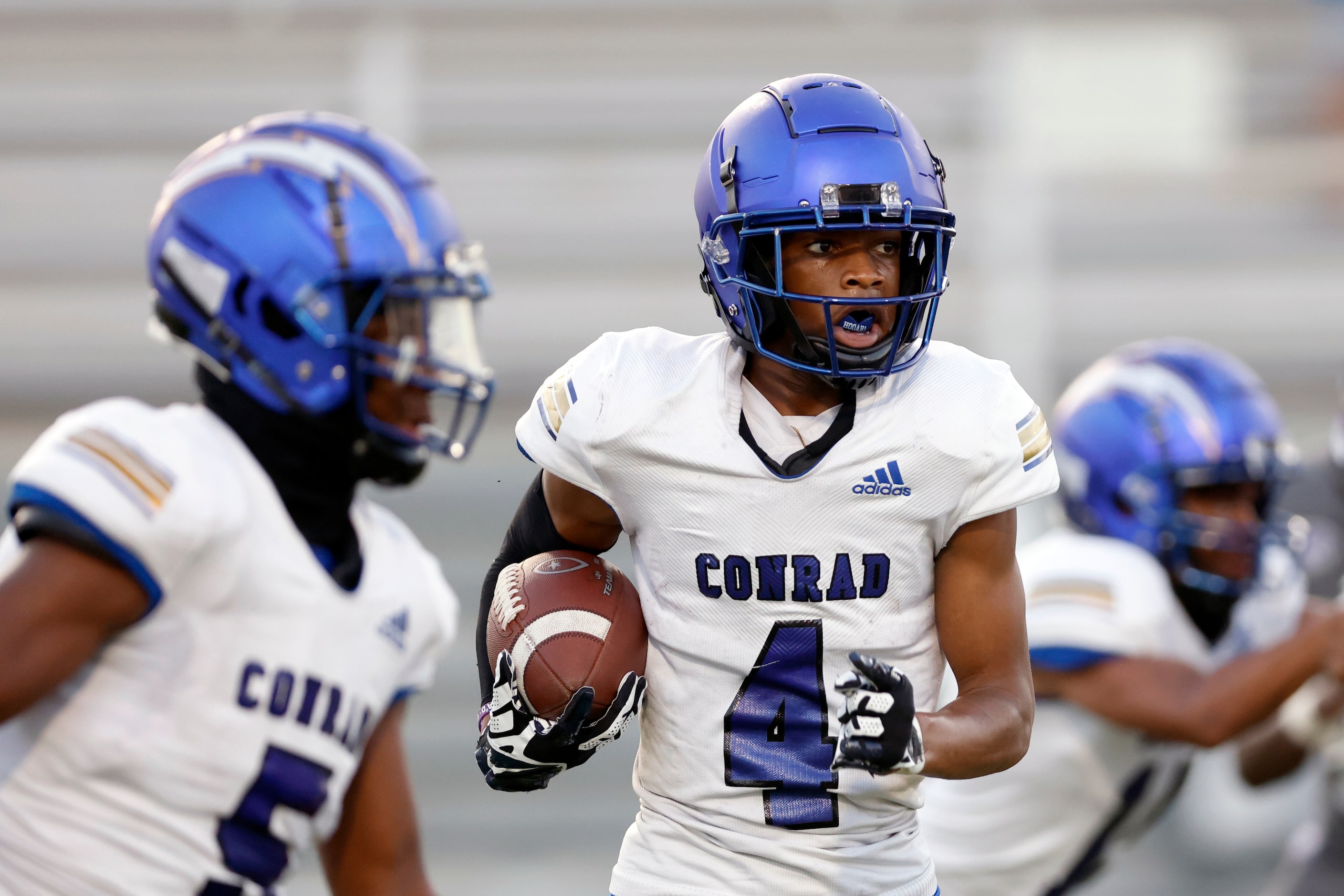 Conrad wide receiver Jonathan Anthony (4) returns a kickoff during the first half of a...