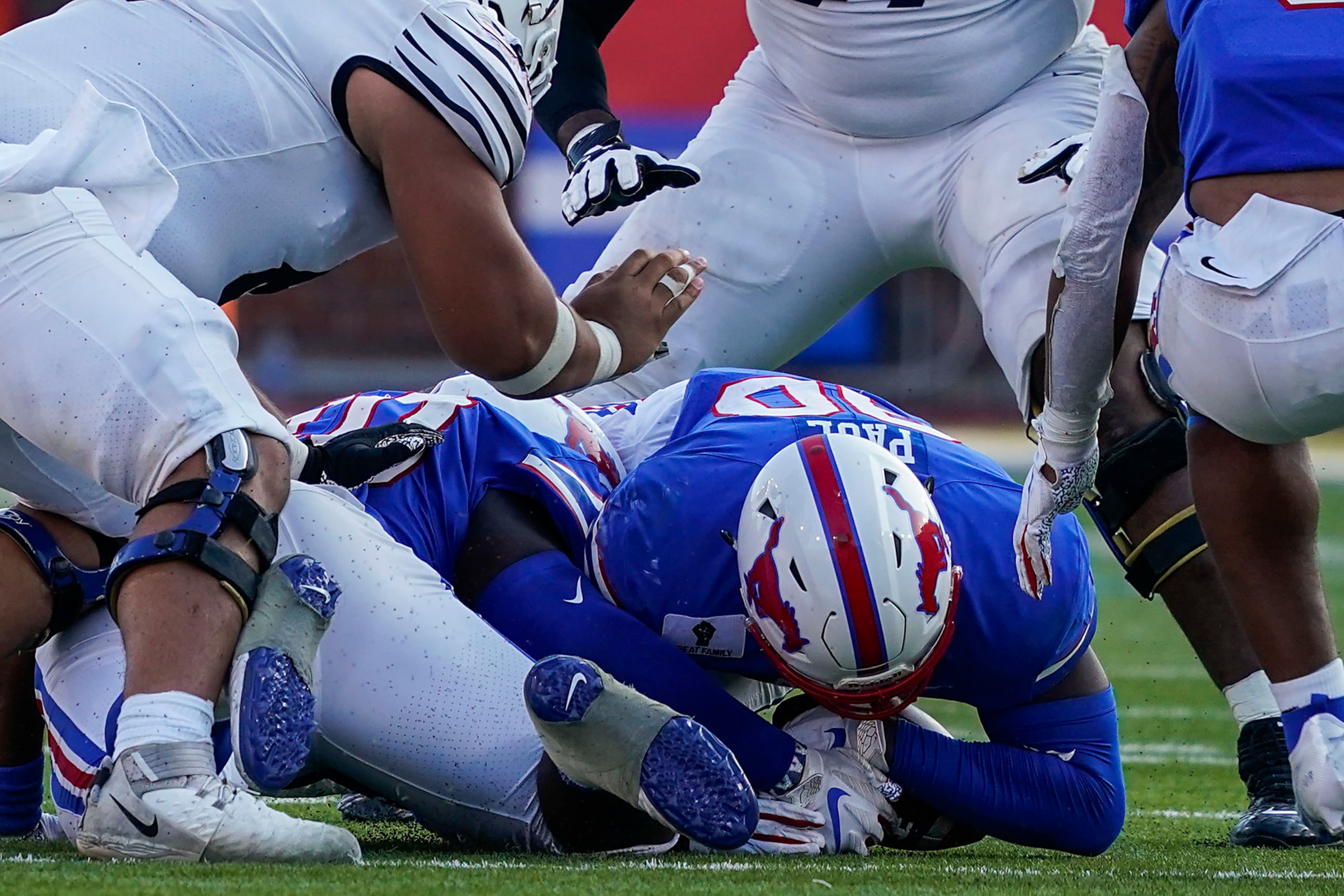 SMU defensive end Nelson Paul (90) reaches for a Memphis fumble that was recovered by the...