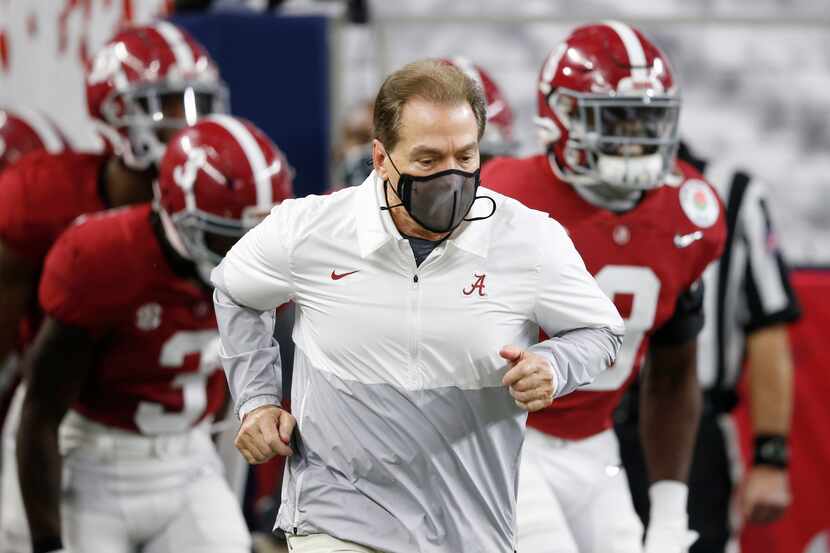 Alabama Crimson Tide head coach Nick Saban runs out with the team during introductions...