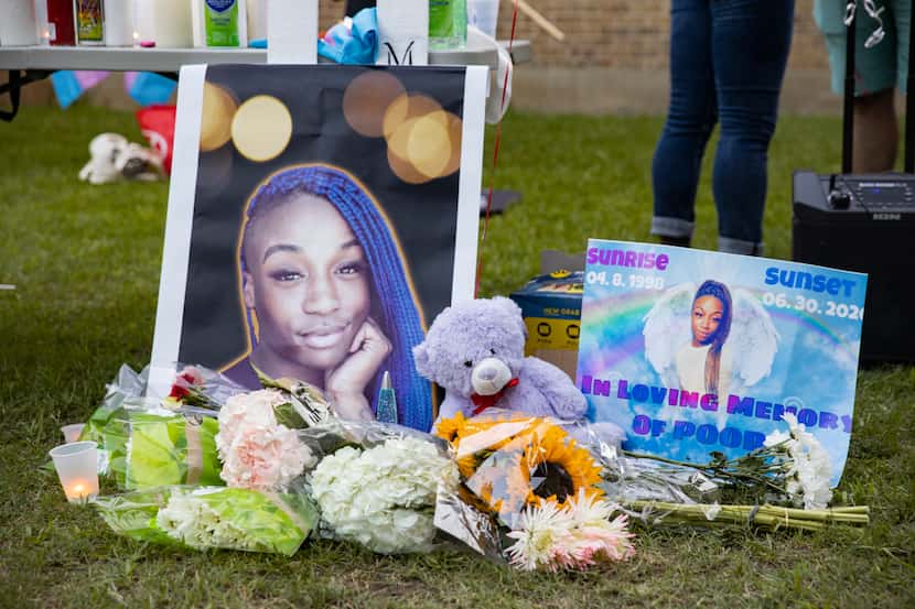 Flowers were placed near portraits of Merci Richey at a July 4, 2020, vigil.