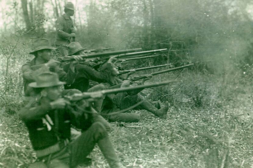 Soldiers from the Oregon Volunteer Infantry fire on Philippine forces, March 1899. From...