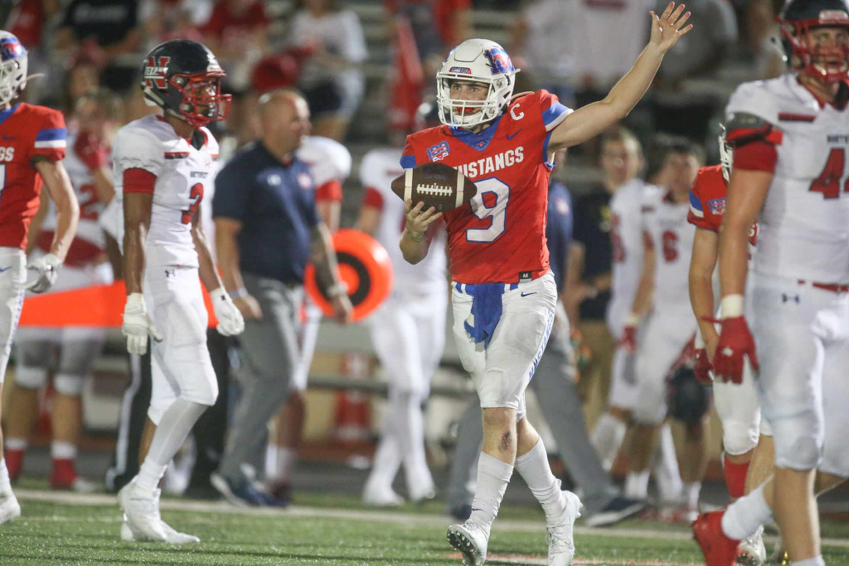 Grapevine quarterback Austin Alexander (9) signals first down during the second half of a...