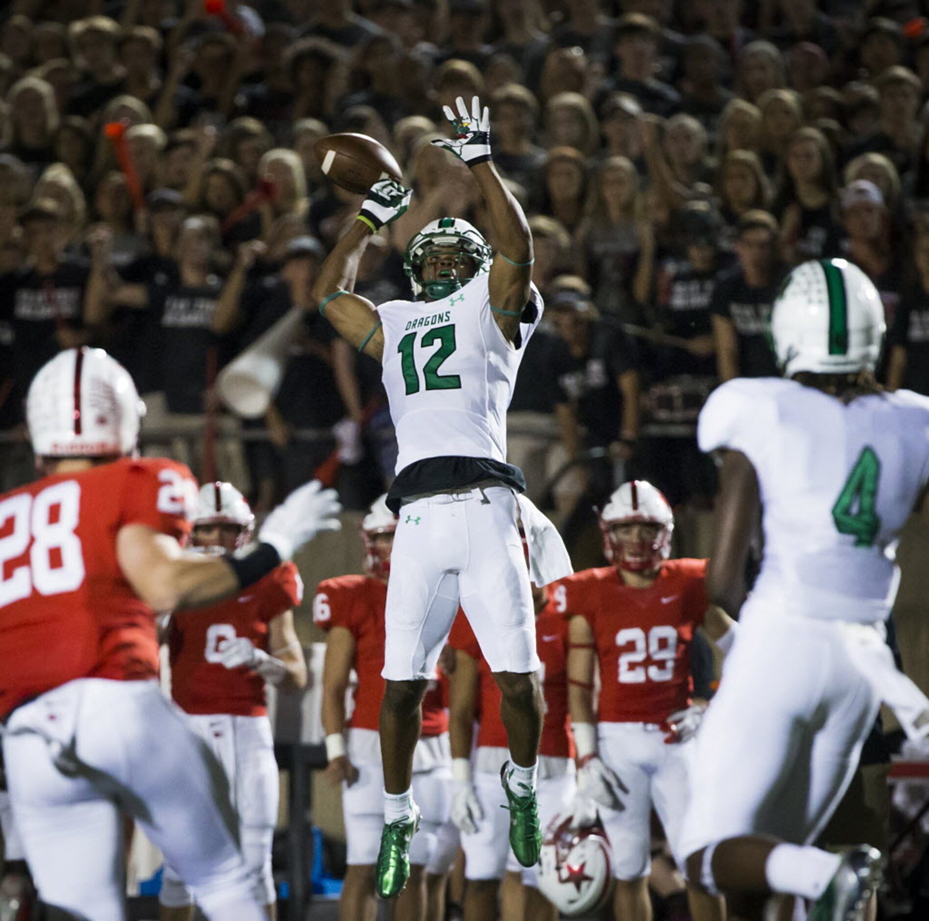 Southlake Carroll wide receiver Zach Farrar (12) has a pass go through his hands during the...