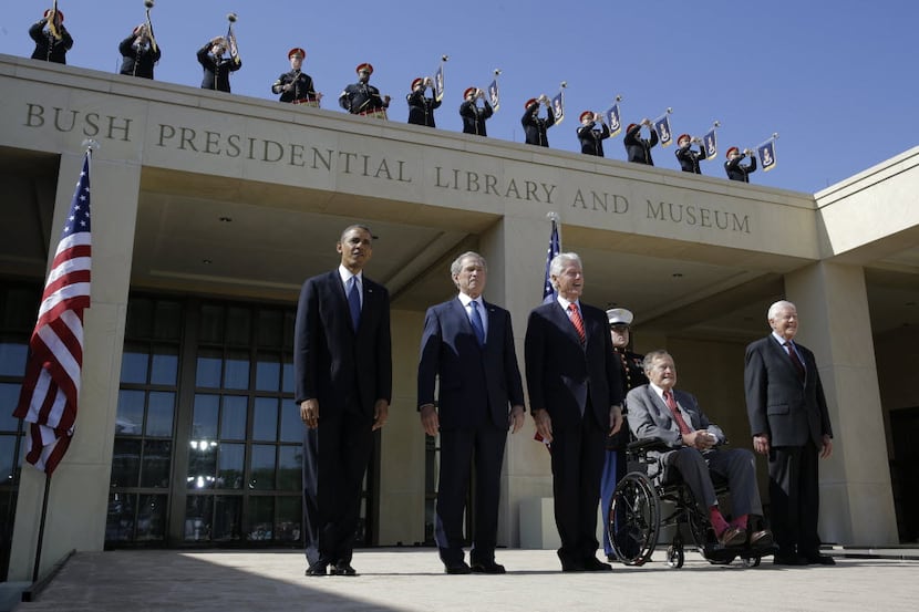 From left, President Barack Obama, former president George W. Bush, former president William...