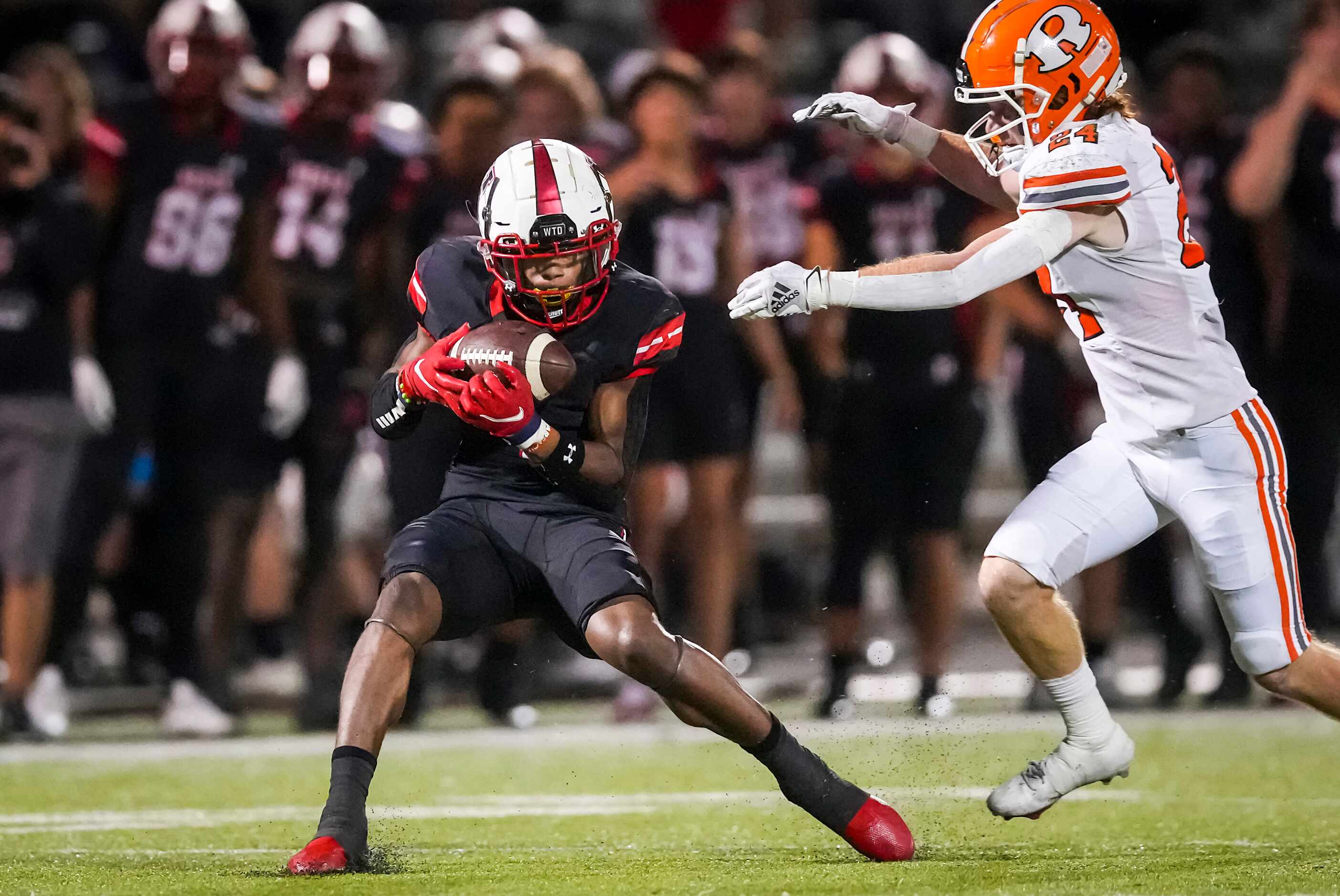 Rockwall-Heath wide receiver Jay Fair (1) hauls in a 69-yard touchdown reception as Rockwall...