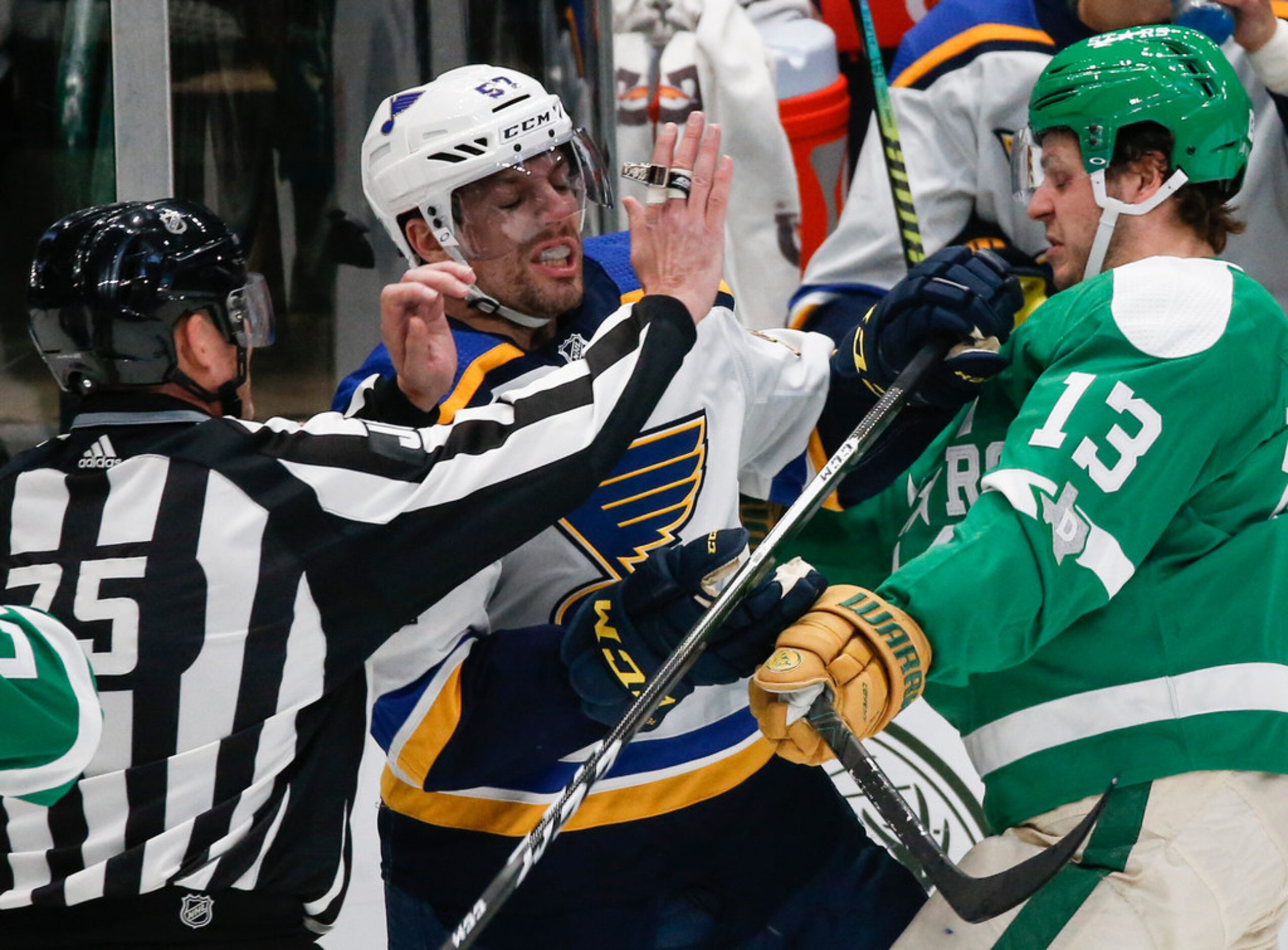 St. Louis Blues left wing David Perron (57) and Dallas Stars center Mattias Janmark (13)...