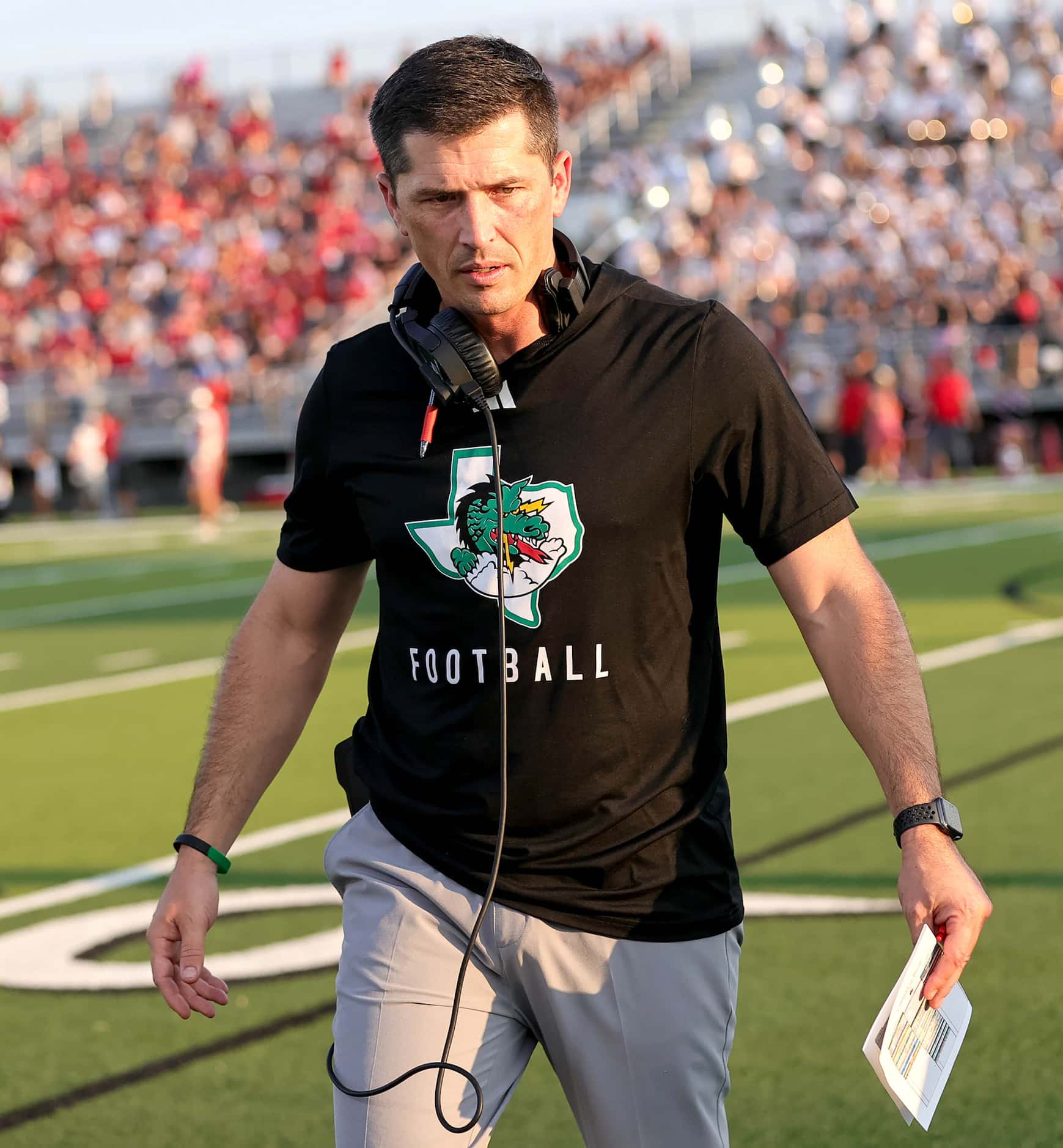 Southlake Carroll head coach Riley Dodge walks back to the sideline during  the first half...