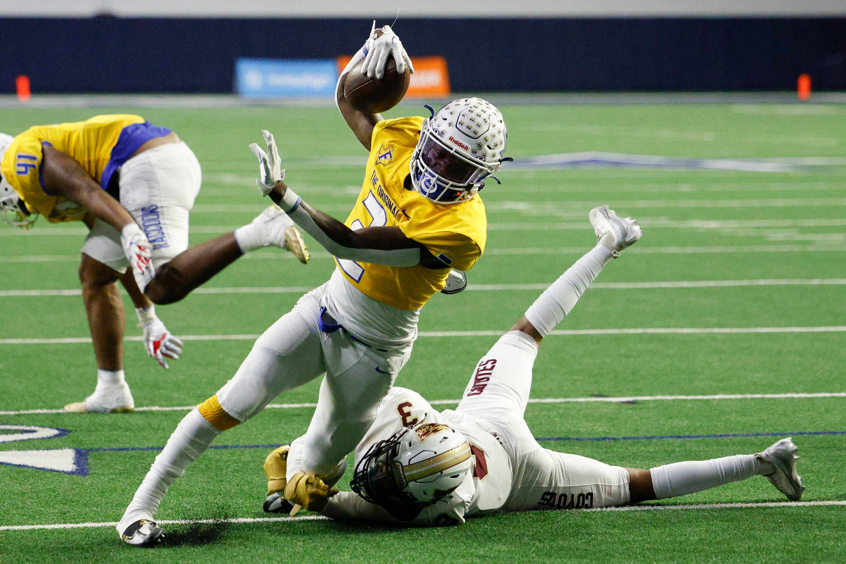 Frisco Heritage defensive back D'andre Stephens (3) tackles Frisco wide receiver Ismael...