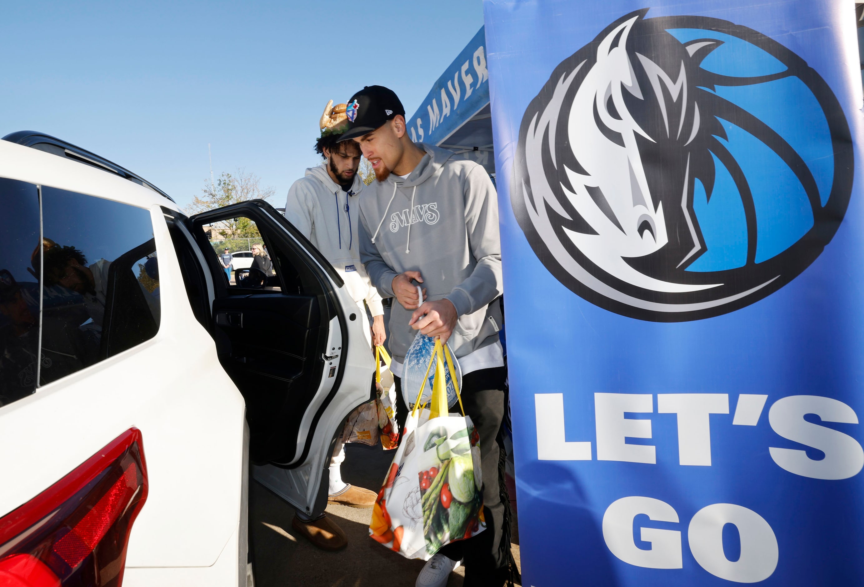 Dallas Mavericks center Dereck Lively II, left, and Dallas Mavericks center Dwight Powell...