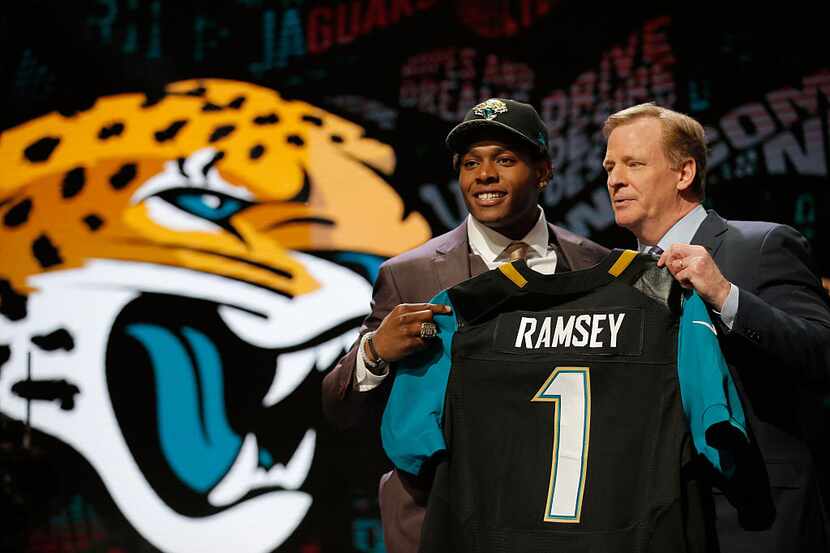 CHICAGO, IL - APRIL 28:  (L-R) Jalen Ramsey of the Florida State Seminoles holds up a jersey...