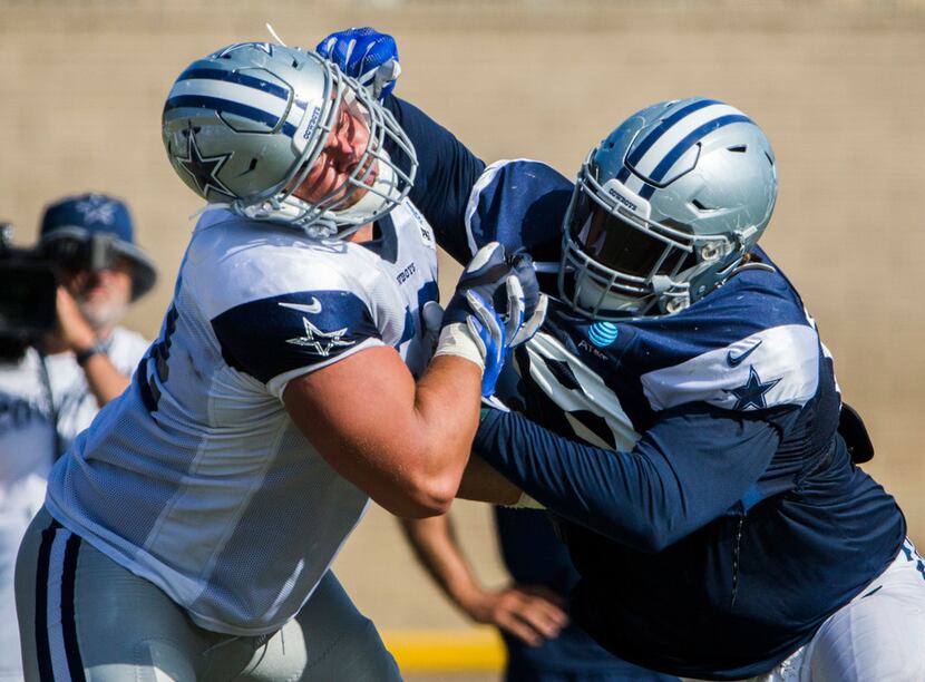 Dallas Cowboys defensive tackle Trysten Hill (79, right) takes on offensive guard Connor...