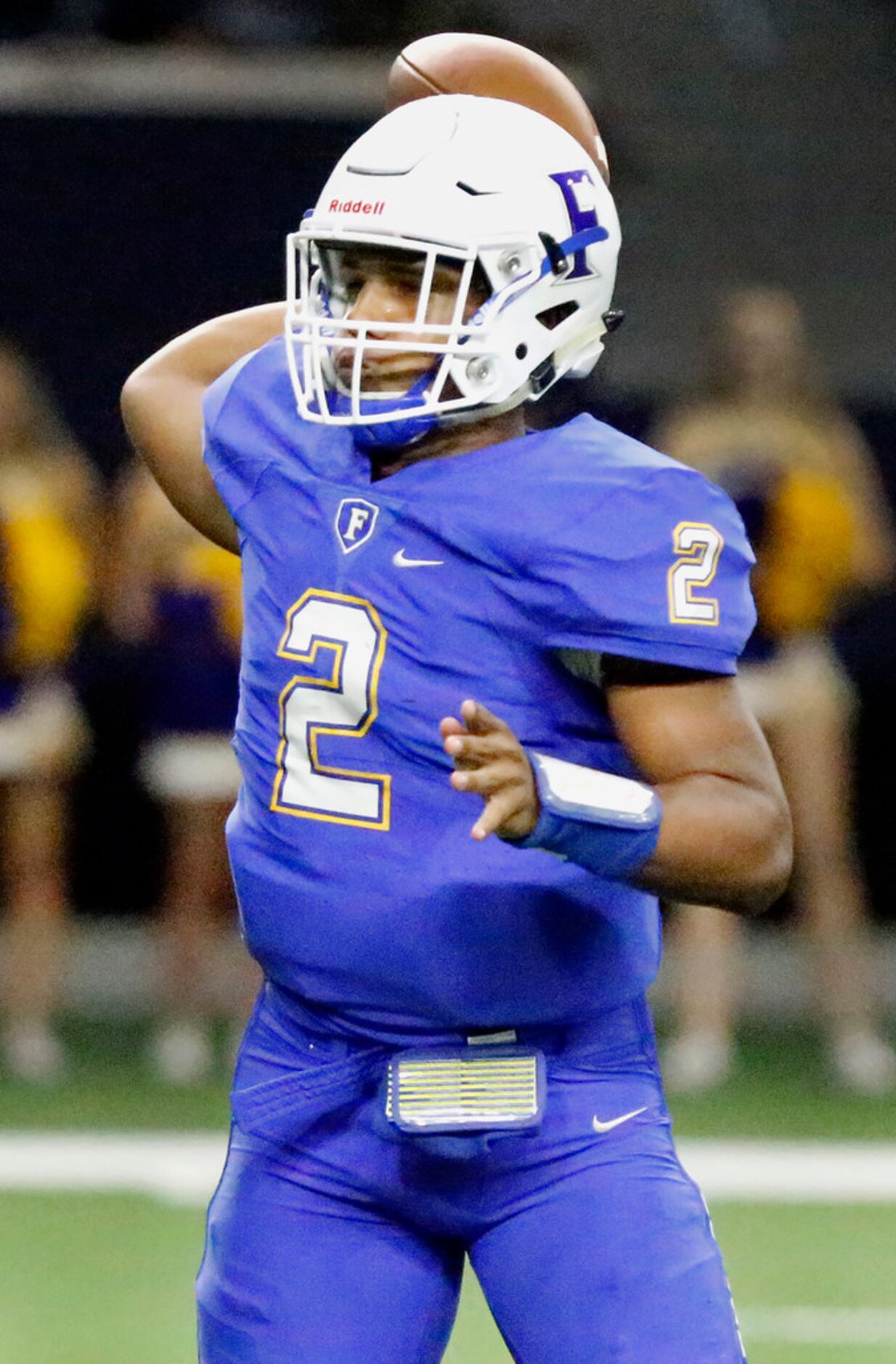 Frisco High School quarterback Caree Green (2) throws a pass during the first half as Reedy...