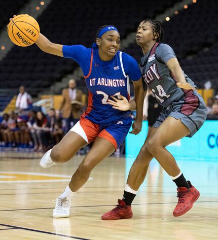 Terryn Milton (No. 21) takes on Troy's Tiyah Johnson (No. 14) during the Sunbelt Conference...
