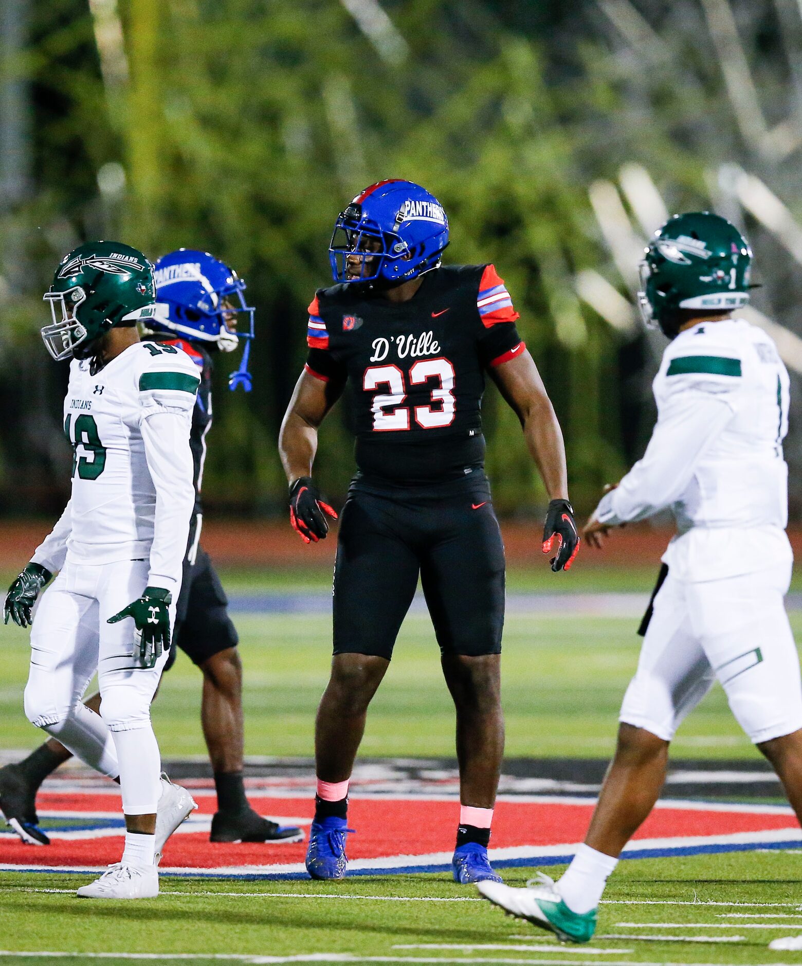 Duncanville senior defensive lineman Omari Abor (23) looks on between plays during the...