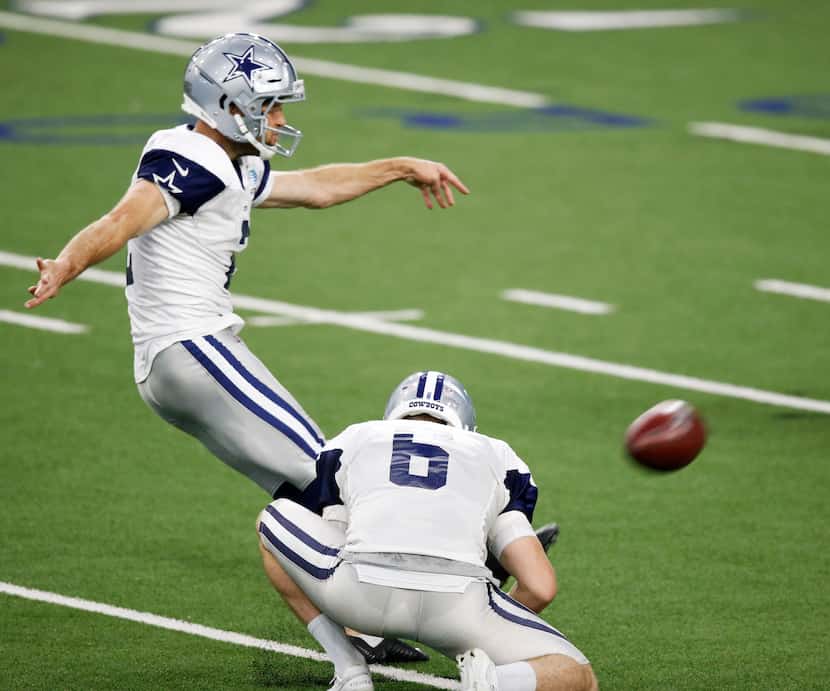 Dallas Cowboys place kicker Greg Zuerlein (2) attempts a field goal as Dallas Cowboys punter...