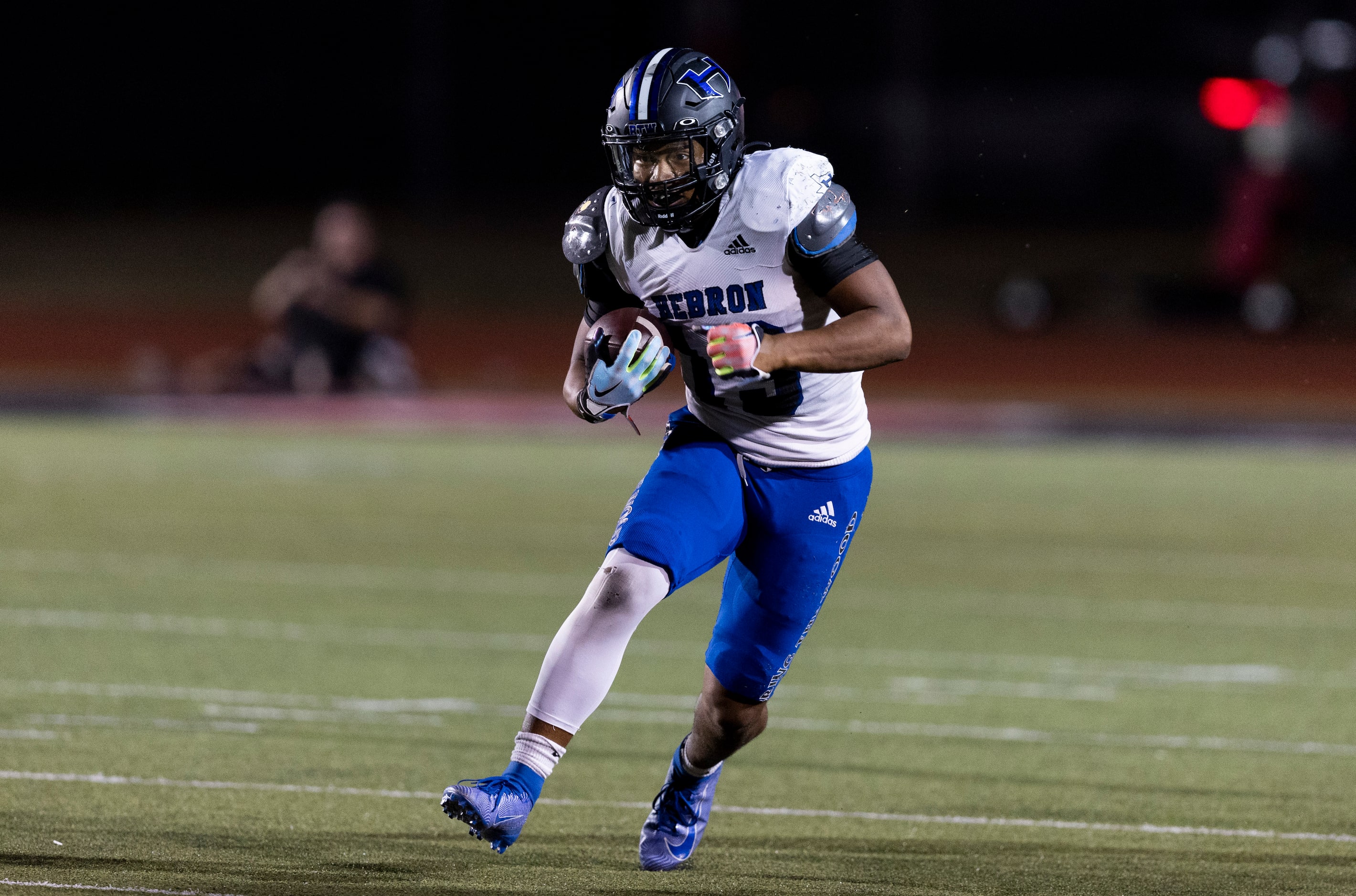 Hebron senior running back Bryson Spriggs (13) carries the ball during the first half of a...