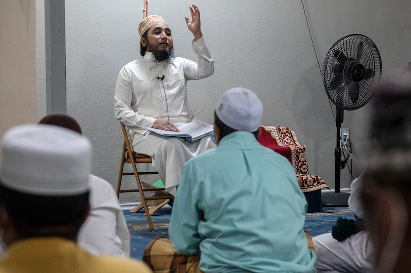 Mohammad Ismail, the imam, or leader of the mosque, spoke before conducting prayer with...