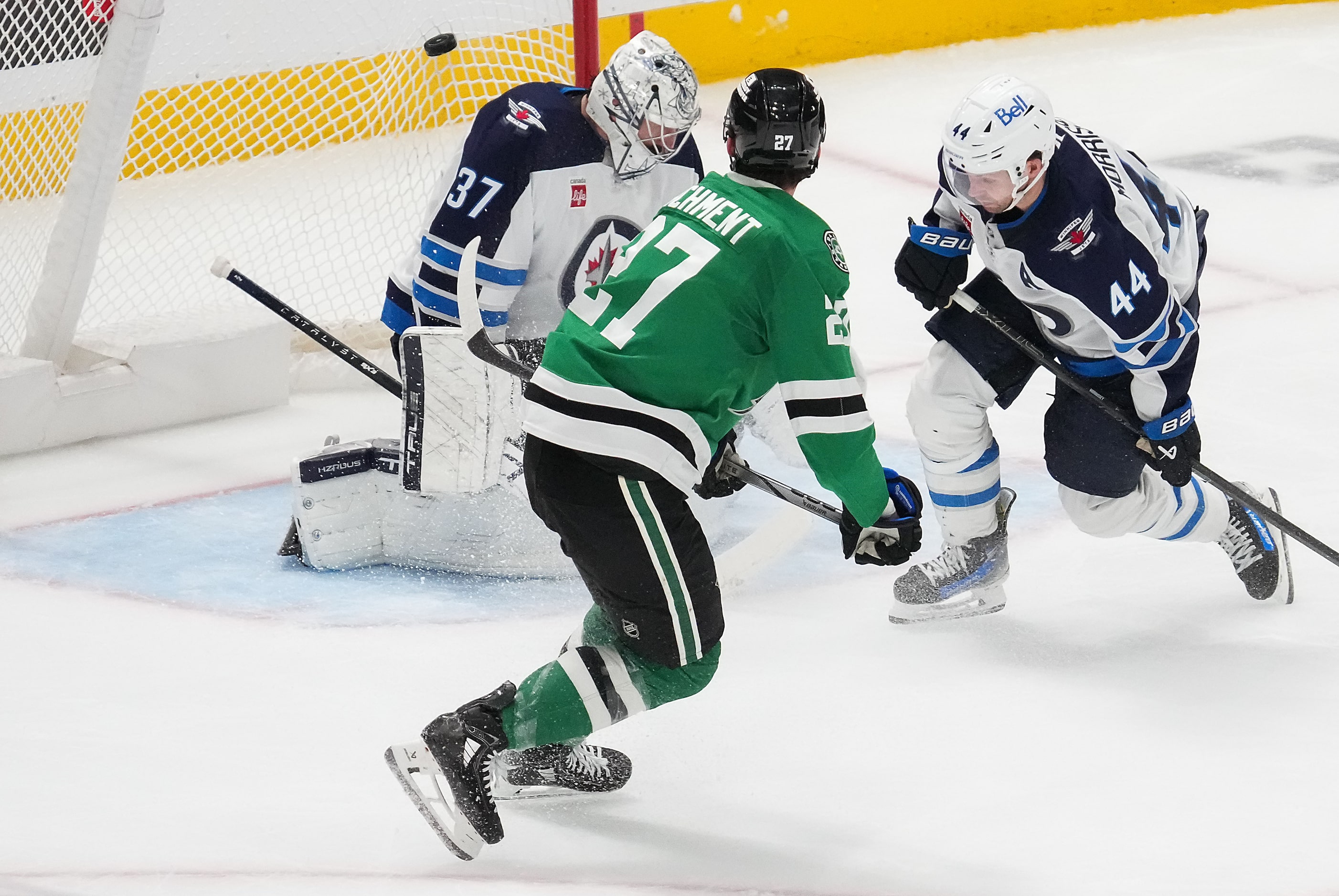 Dallas Stars left wing Mason Marchment (27) puts a back-handed shot past Winnipeg Jets...