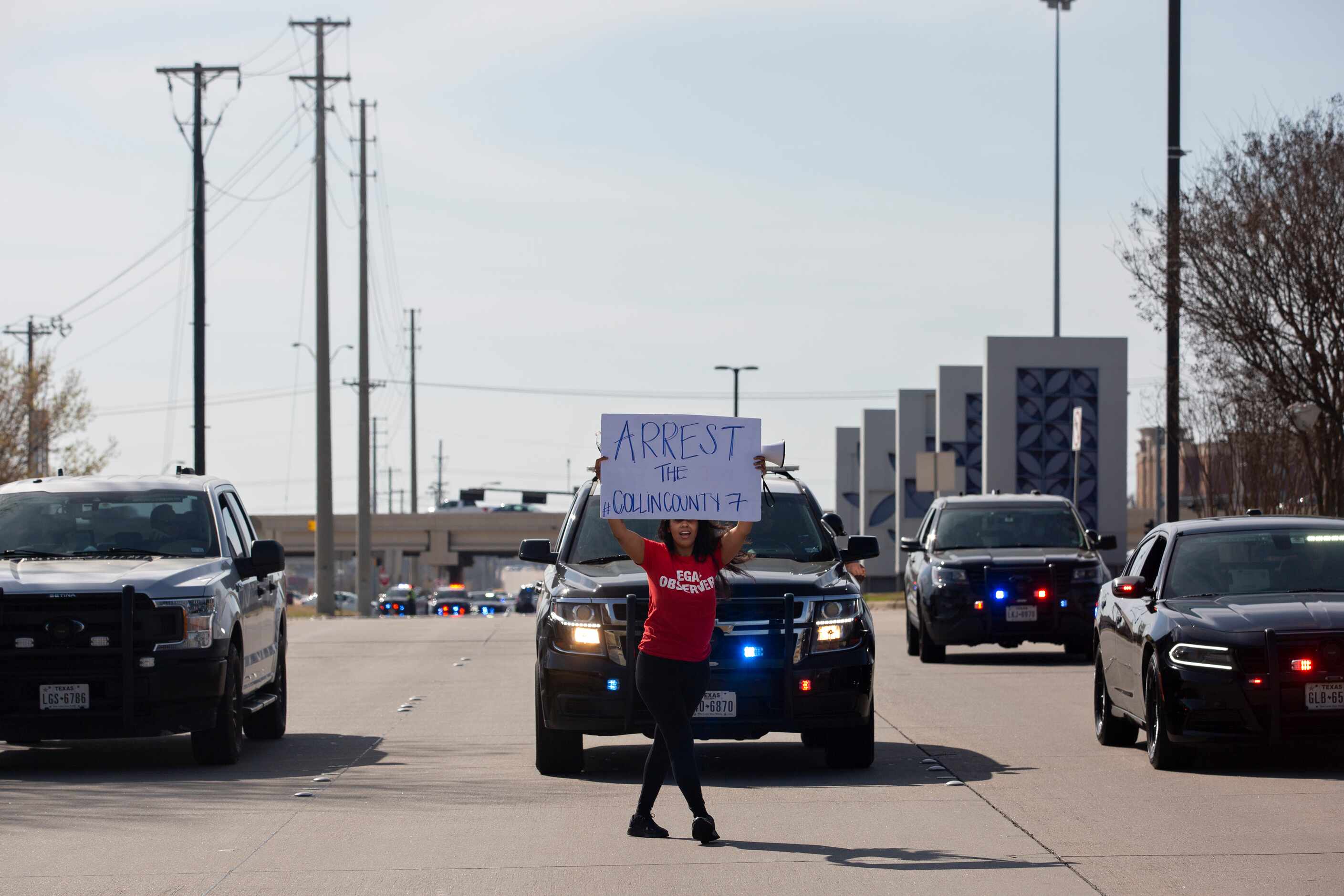 Renee White dances down the street as the tail end of the march leaving the Allen Outlets on...