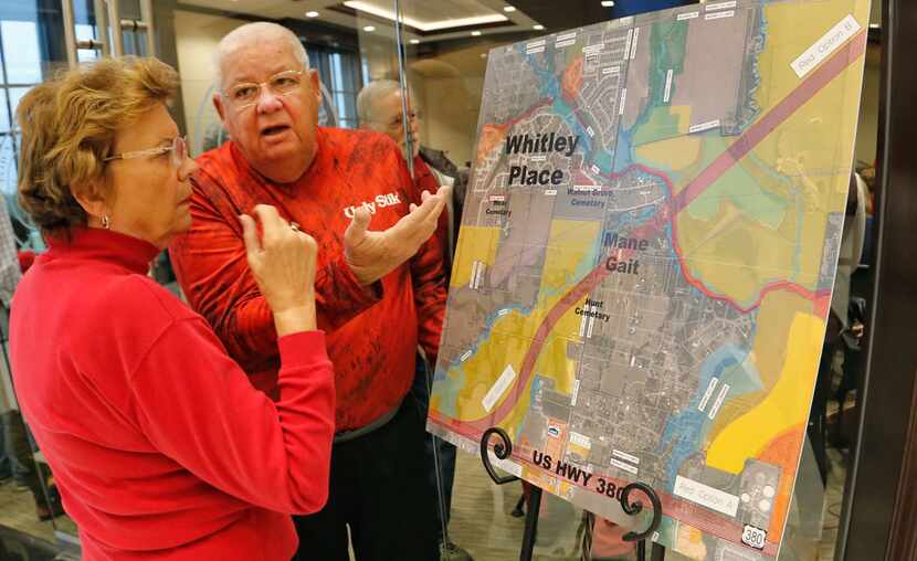 Prosper residents Marcia and Donald Isch talk about the 380 bypass proposal while they look...