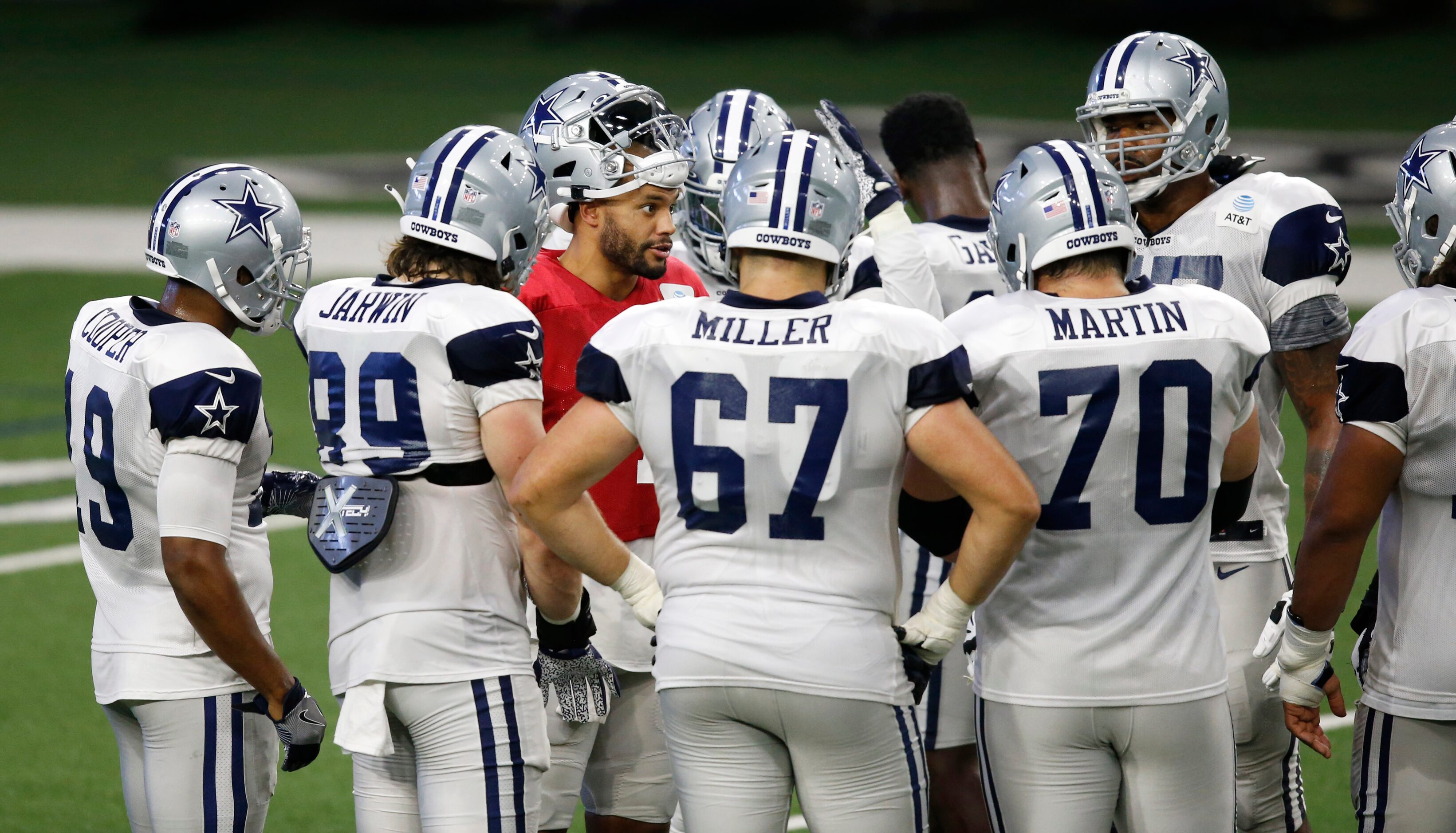 Dallas Cowboys quarterback Dak Prescott (4) talks in the huddle before a play during...