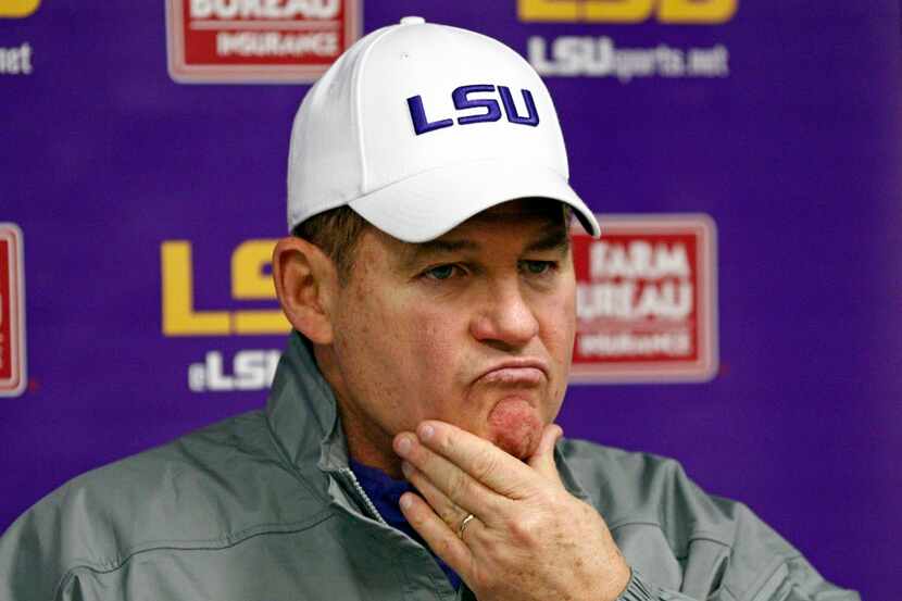 LSU head coach Les Miles ponders a reporter's question's following an NCAA college football...