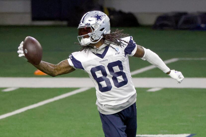 Dallas Cowboys wide receiver CeeDee Lamb (88) makes a catch during an NFL football practice...