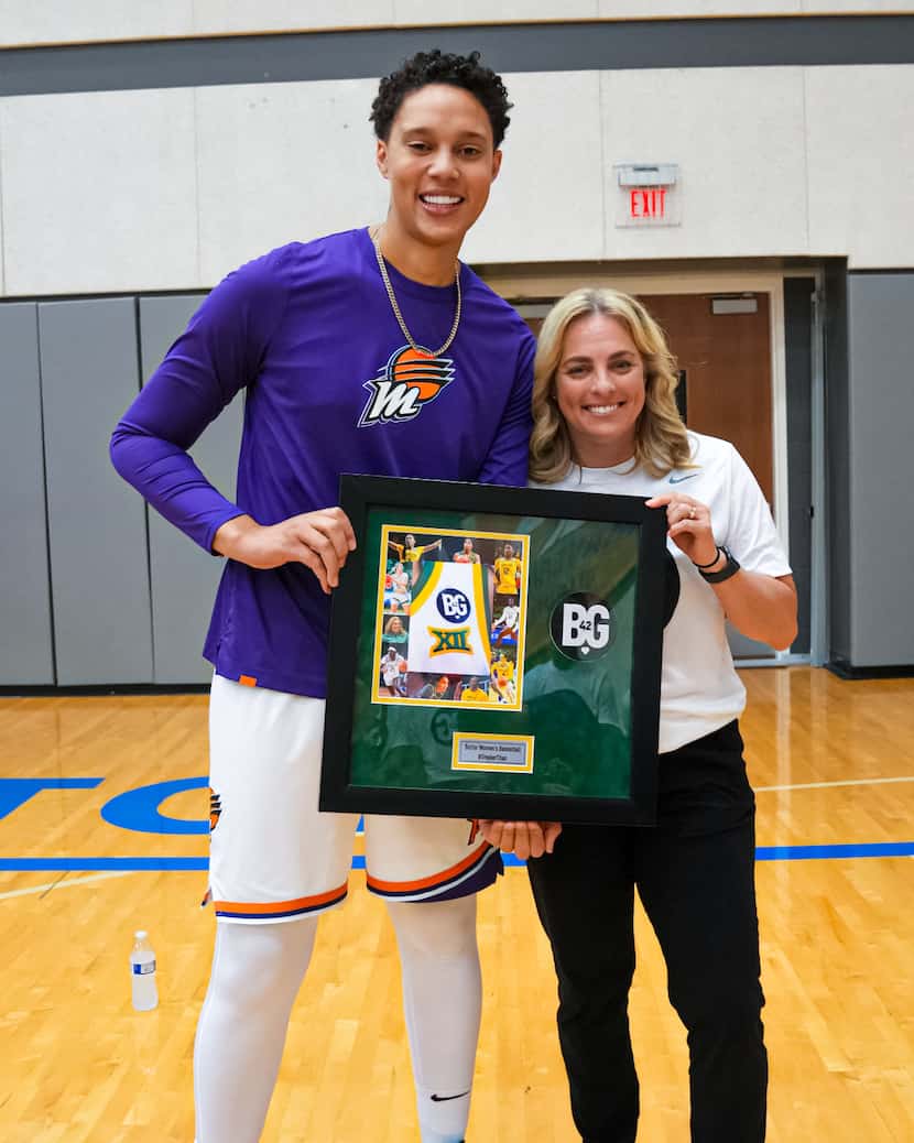 Phoenix Mercury star Brittney Griner accepts a commemorative frame from Baylor women's...