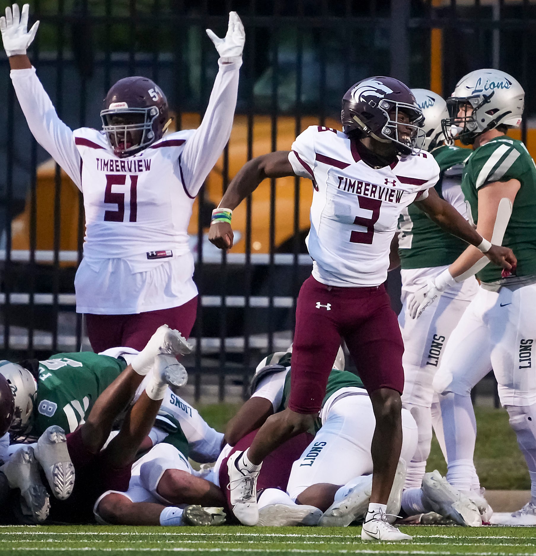 Mansfield Timberview quarterback Cameron Bates (3) and offensive lineman Aiden Carlisle (52)...