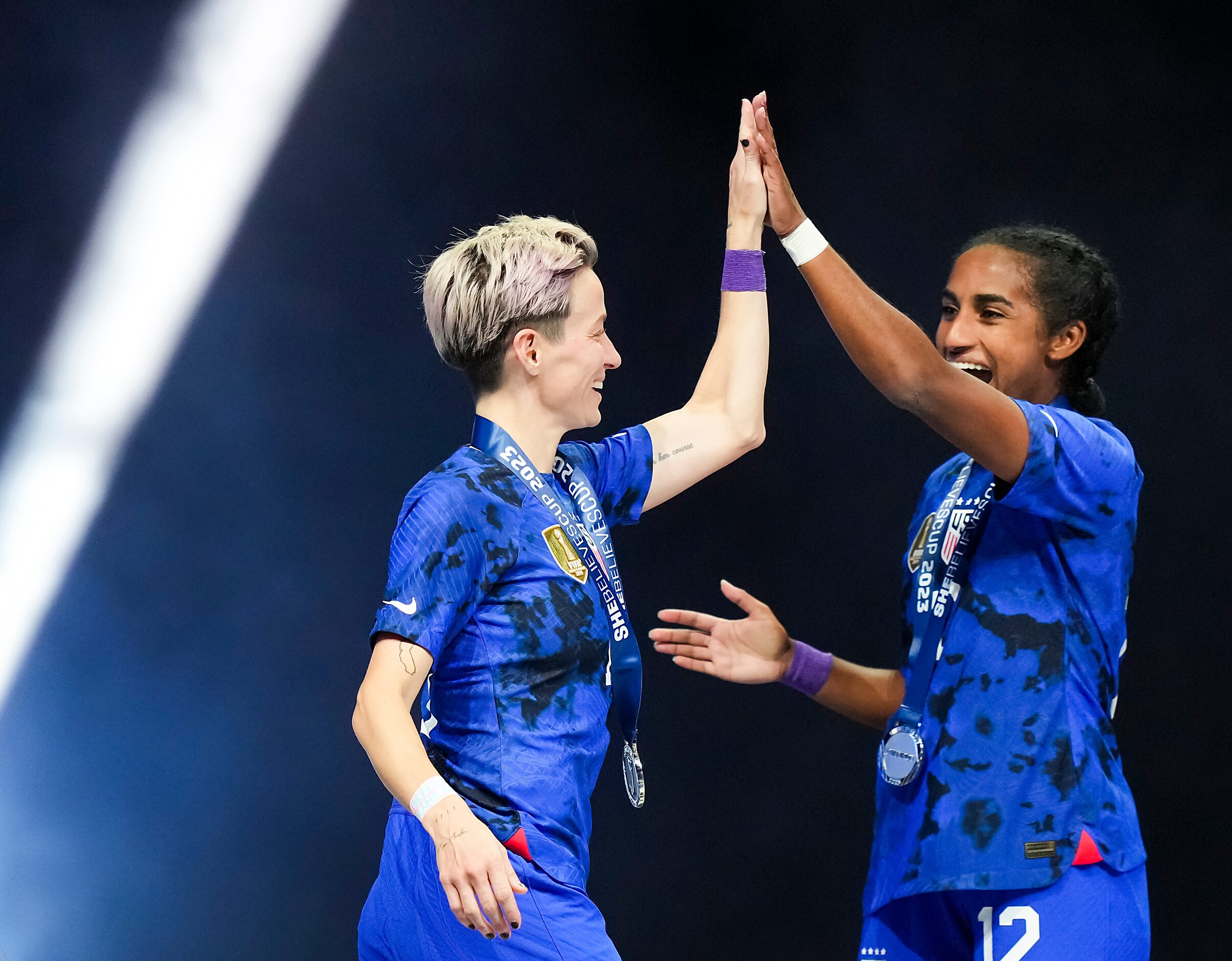 United States forward Megan Rapinoe (15) celebrates with defender Naomi Girma (12) after...