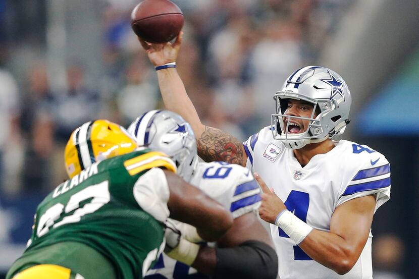 Dallas Cowboys quarterback Dak Prescott (4) attempts a pass in a game against the Green Bay...