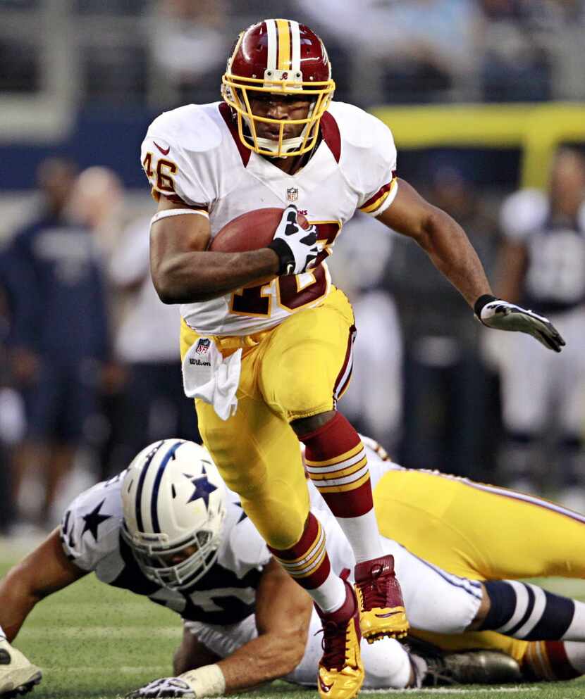 Washington Redskins running back Alfred Morris finds a hole in the Dallas Cowboys line...
