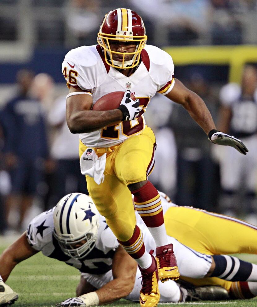 Washington Redskins running back Alfred Morris finds a hole in the Dallas Cowboys line...