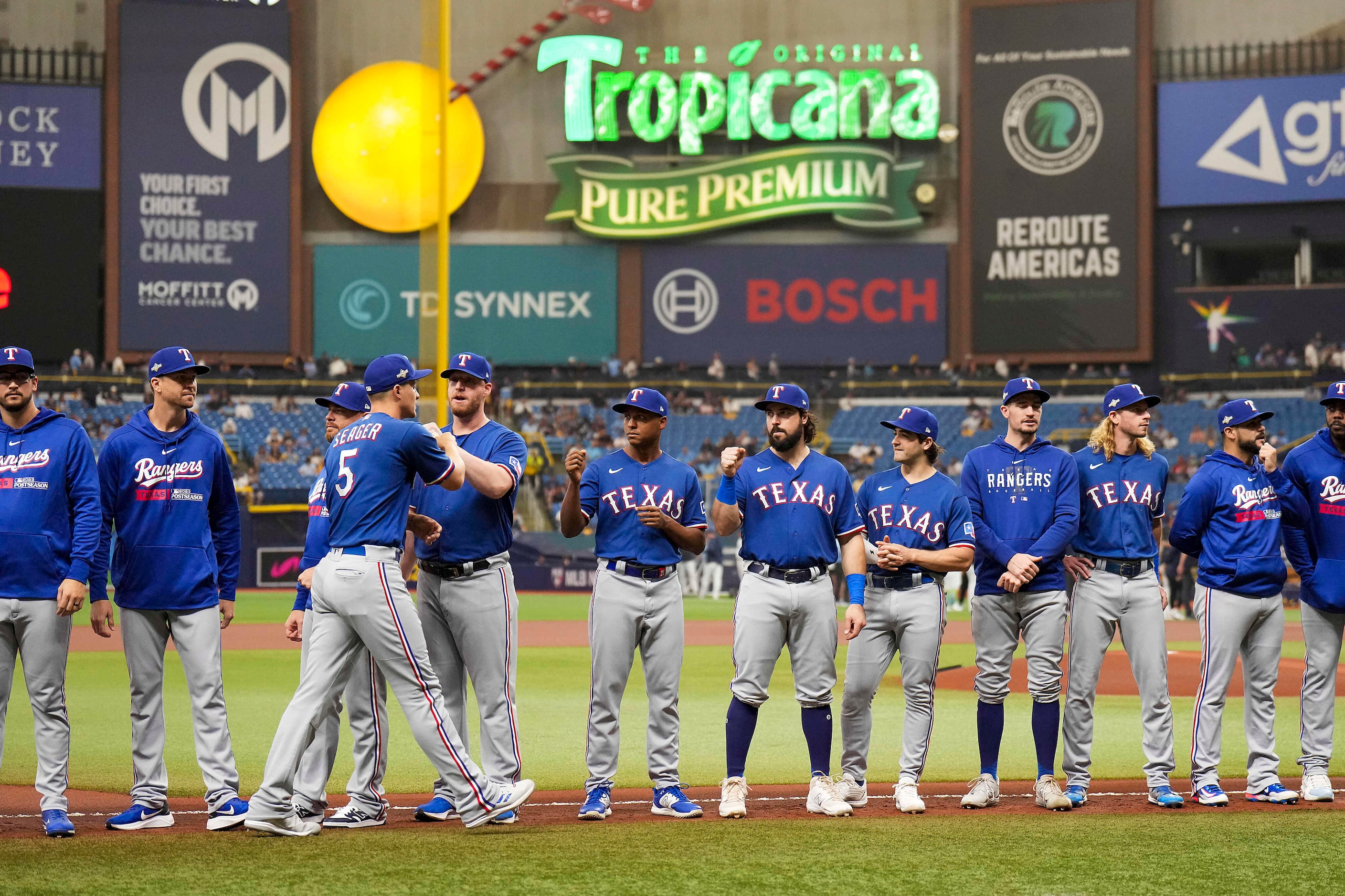 Texas Rangers shortstop Corey Seager (5) fist bumps teammates as he is introduced before an...