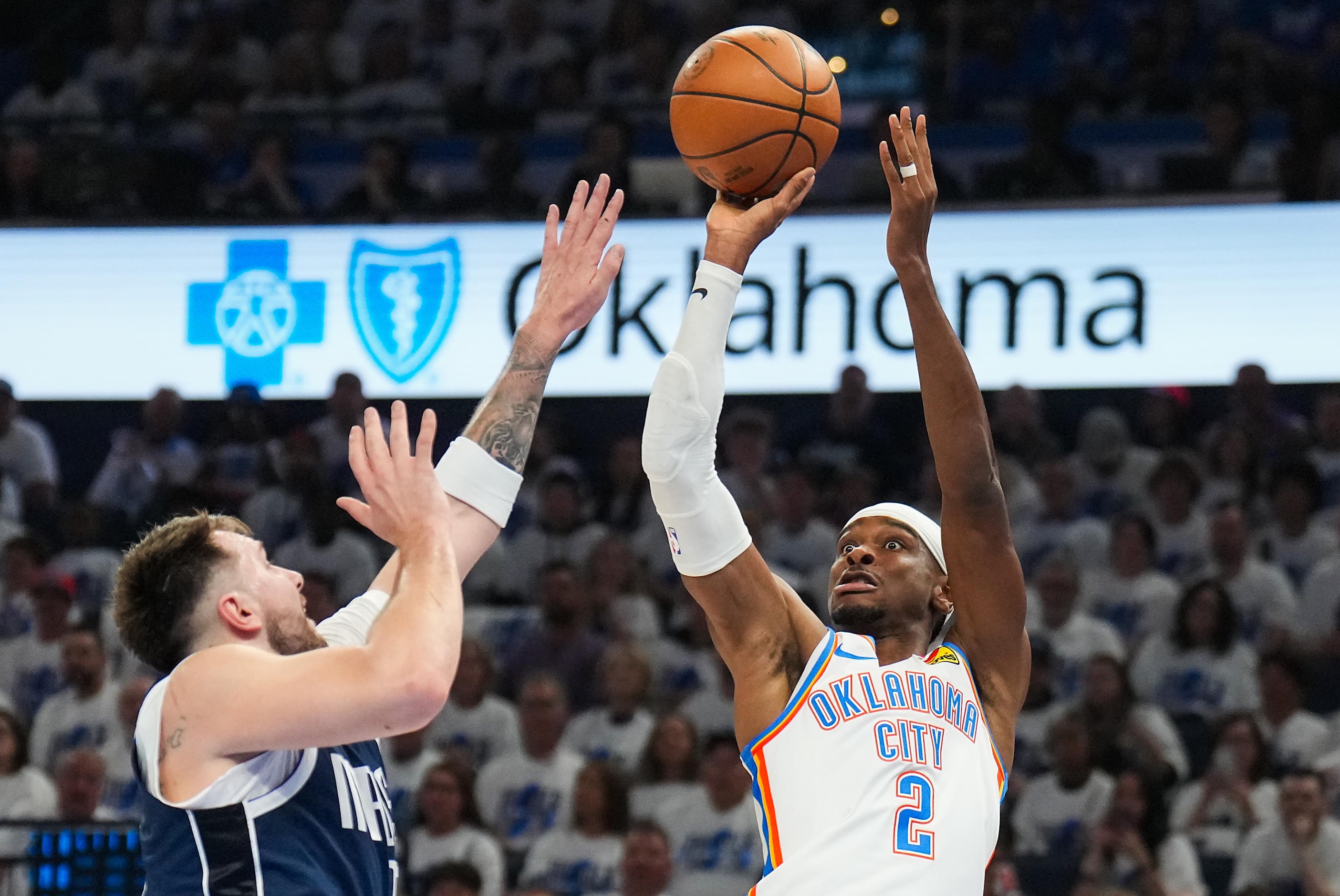 Oklahoma City Thunder guard Shai Gilgeous-Alexander (2) shoots over Dallas Mavericks guard...