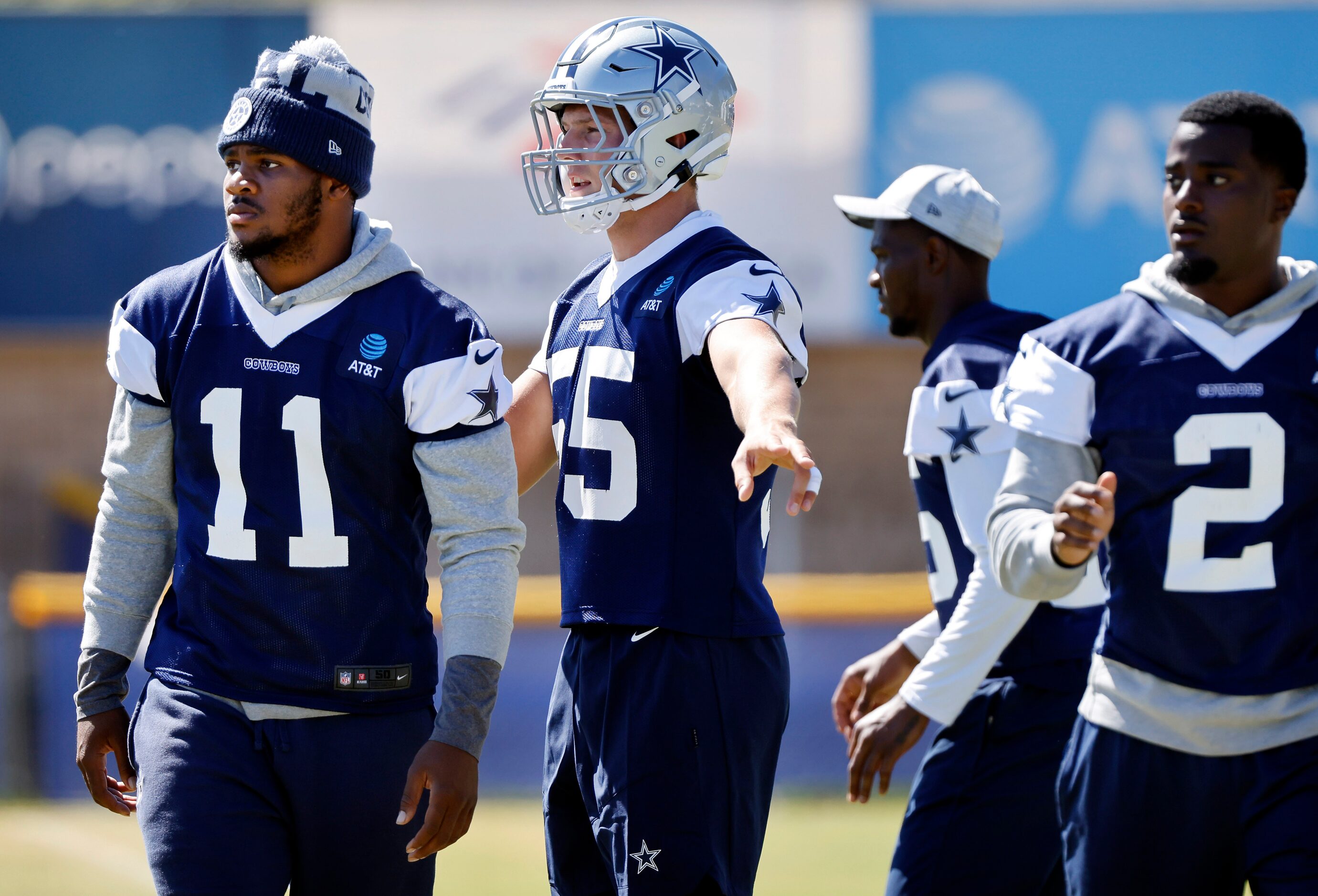 Dallas Cowboys outside linebacker Leighton Vander Esch (55) directs Micah Parsons (11) as...