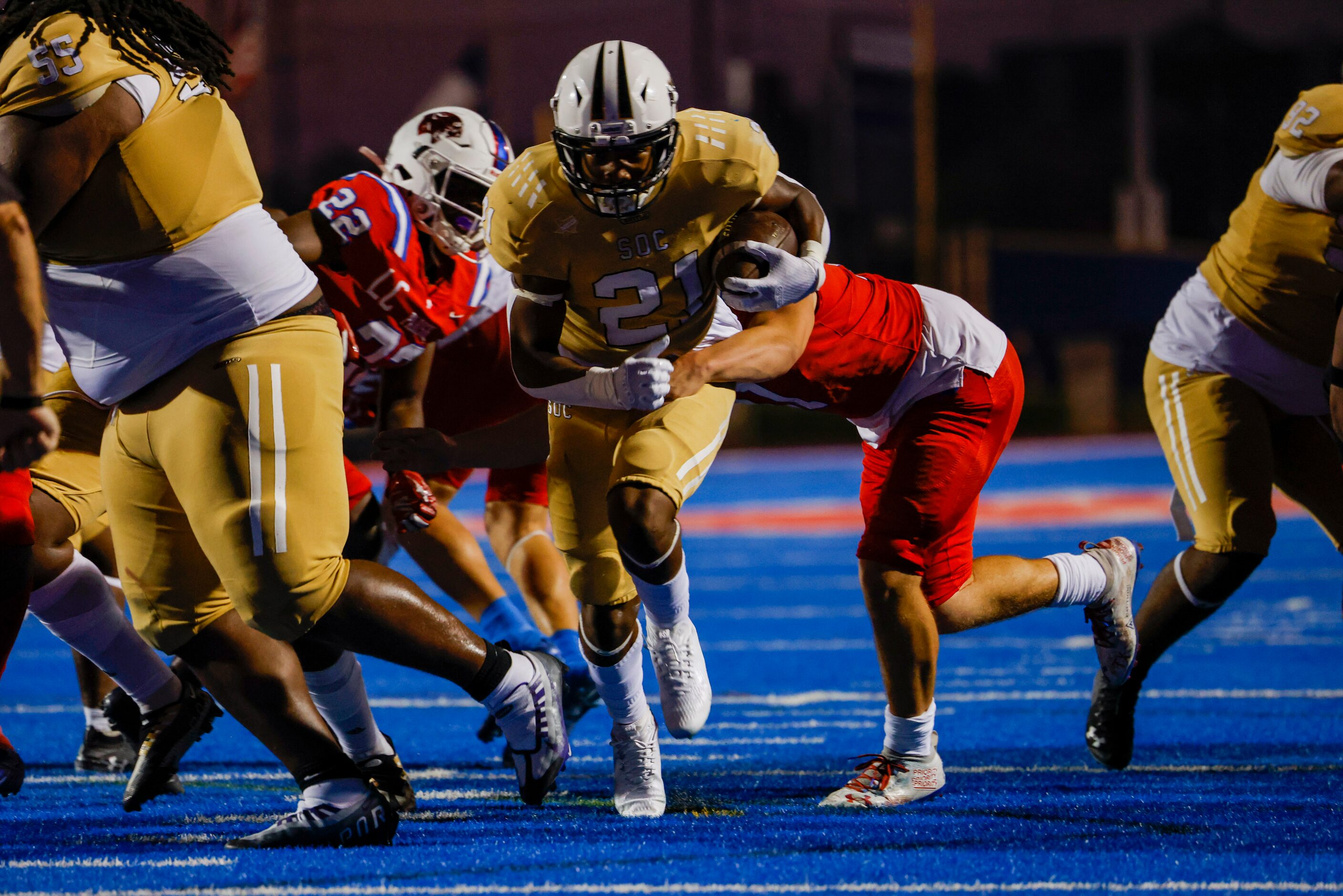 South Oak Cliff’s running back Danny Green (21) evades the Parish Episcopal defense for a...