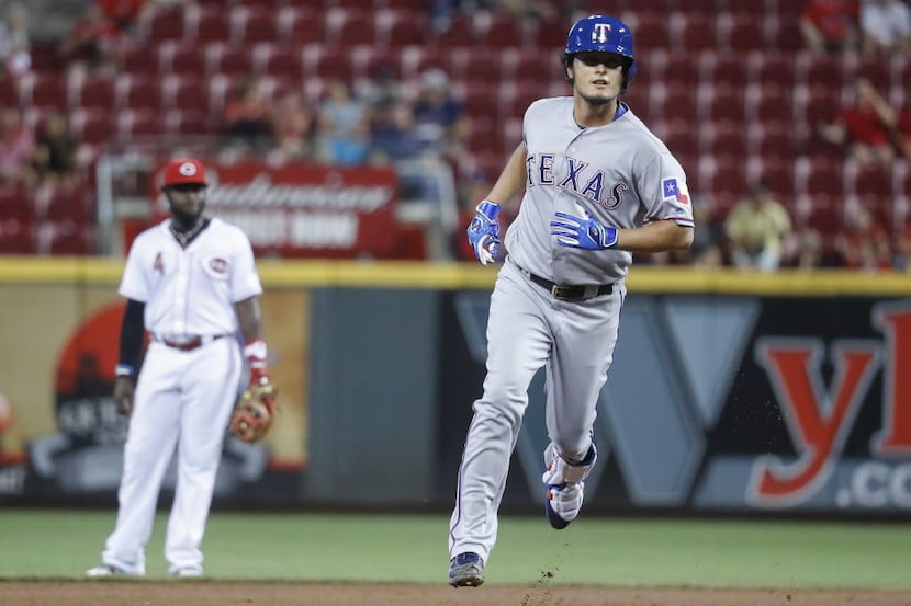 Texas Rangers' Yu Darvish runs the bases after hitting a solo home run off Cincinnati Reds...