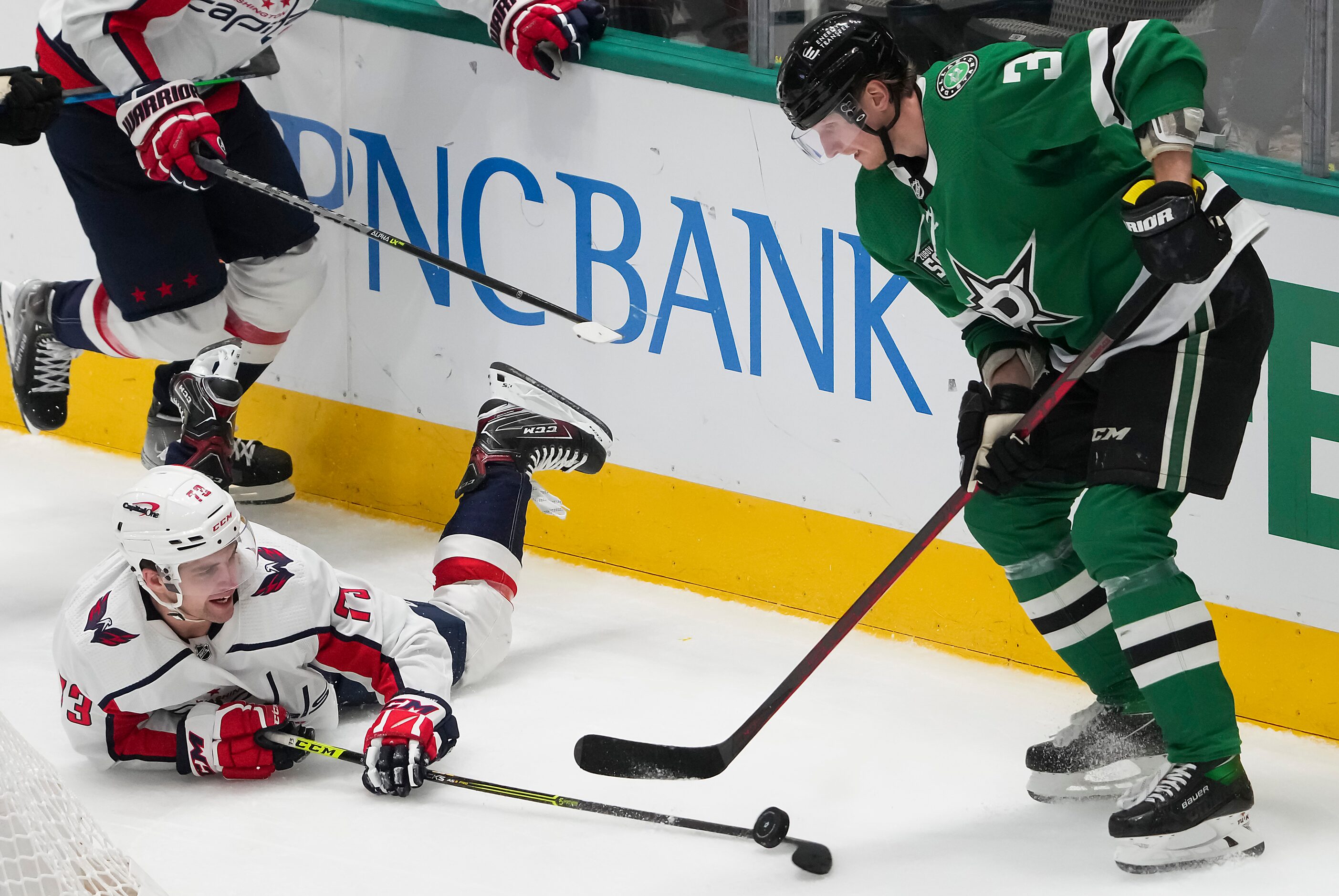 Washington Capitals left wing Conor Sheary (73) knocks the puck away from Dallas Stars...