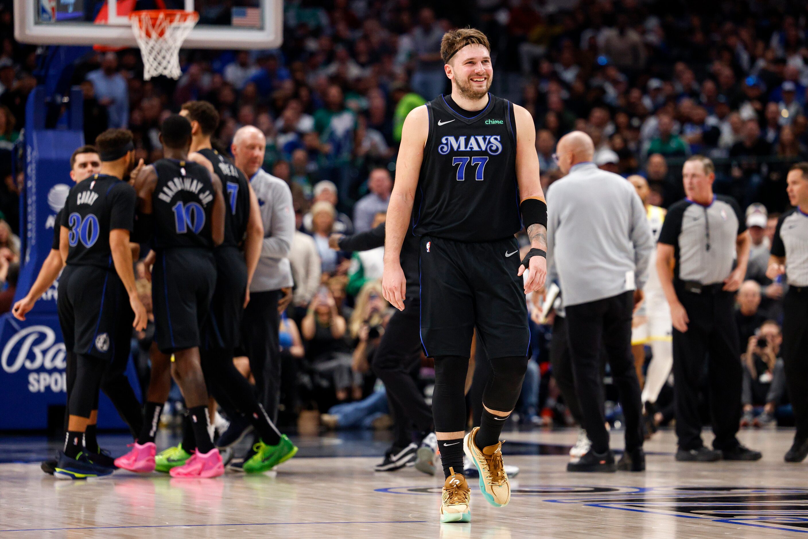 Dallas Mavericks guard Luka Doncic (77) smiles after an exchange of words with Utah Jazz...