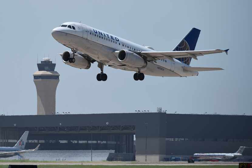 A United Airlines flight takes off at Dallas-Fort Worth Airport on July 1, 2014.  (Michael...