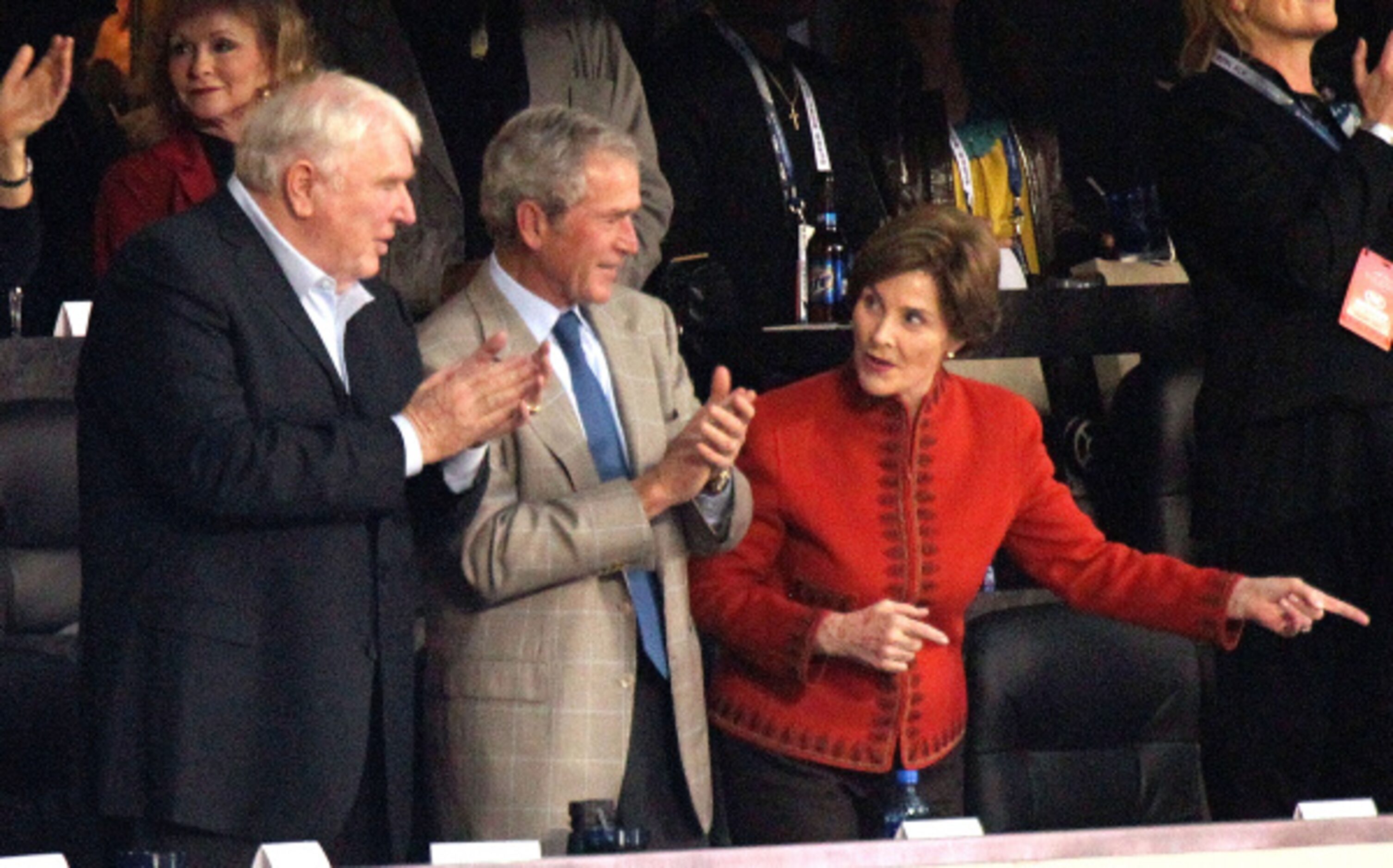 John Madden, former President George W. Bush and Laura Bush enjoy the stadium during Super...