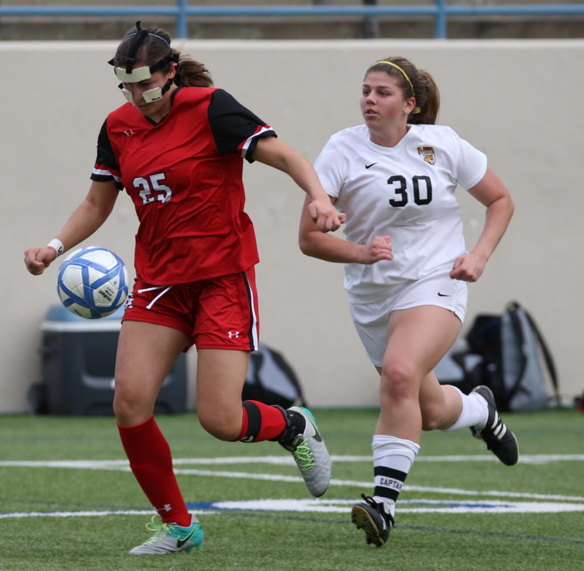 Ursuline Academys Alex Arenas (25) moves the ball past St. Agnes Academys Jordan Howard...