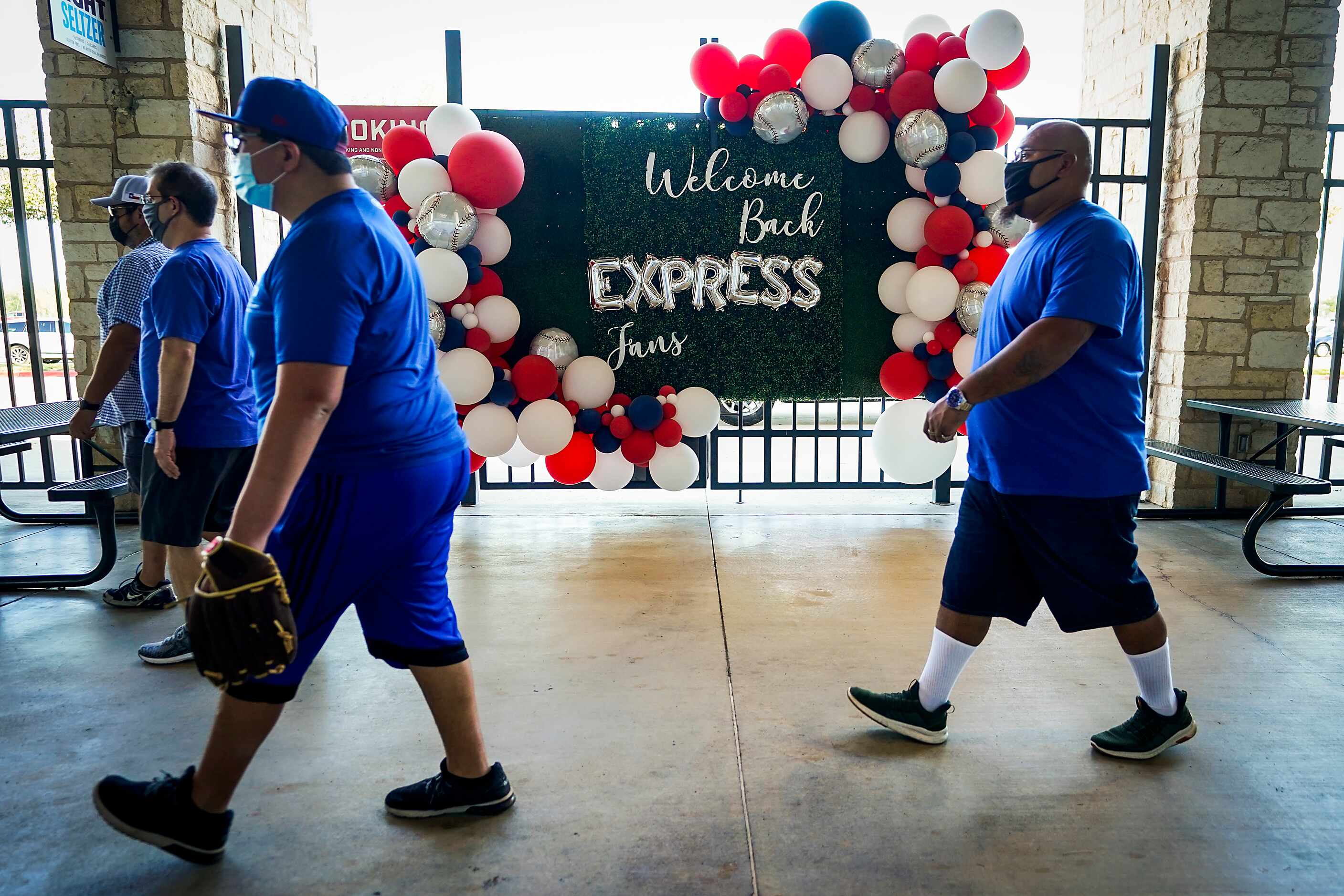 Signs and balloons welcome fans on the concourse after the gates opened at Dell Diamond for...