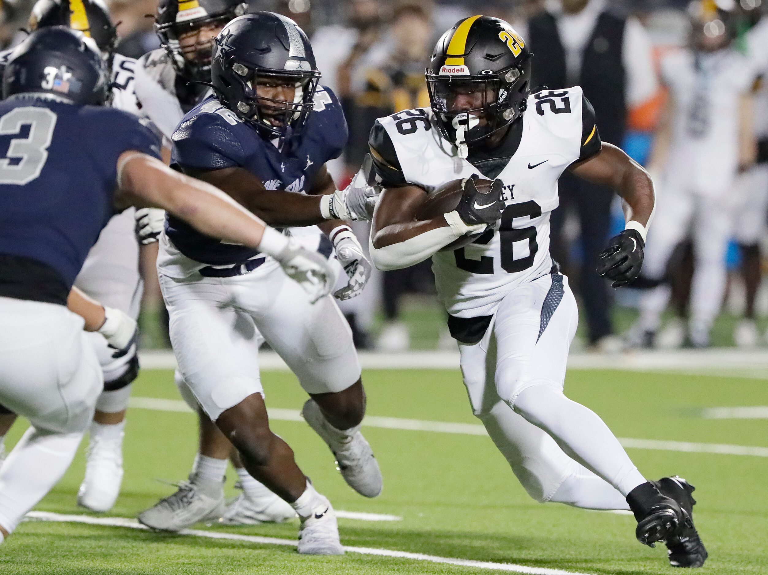 Forney High School running back Javian Osborne (26) runs the ball during the first half as...