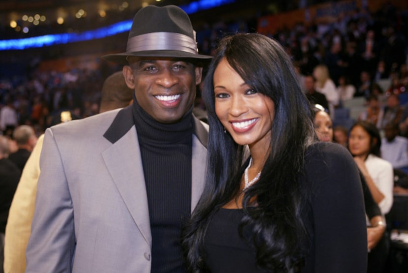 NEW ORLEANS - FEBRUARY 17: Former NFL star Deion Sanders poses for a photo with his wife...