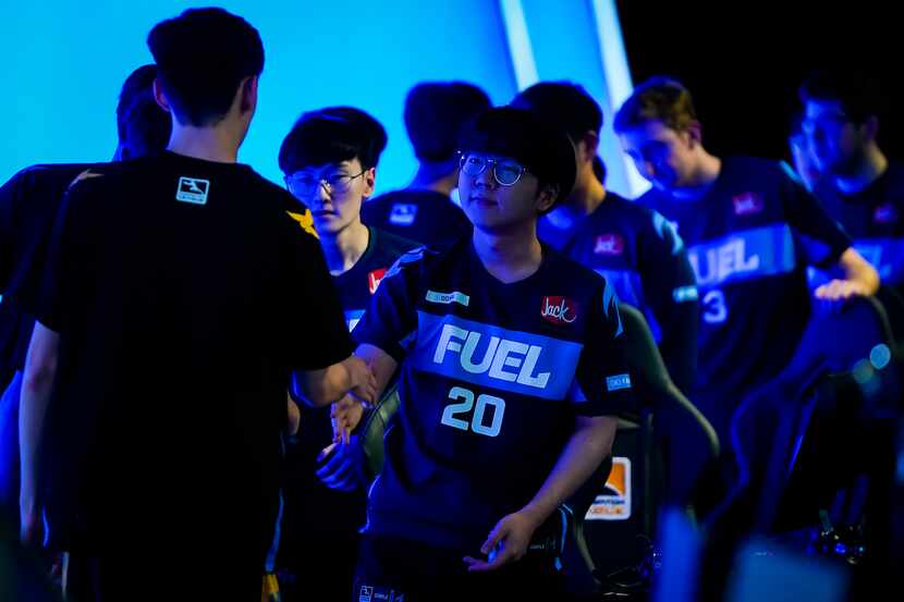 Kim "DoHa" Dongha of the Dallas Fuel congratulates members of the victorious Los Angeles...