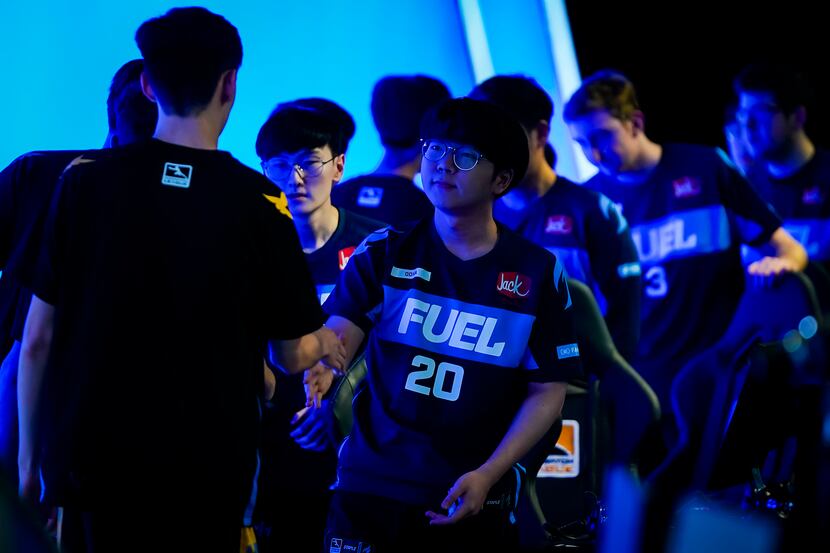Kim ÒDoHaÓ Dong-ha of the Dallas Fuel congratulates members of the victorious Los Angeles...
