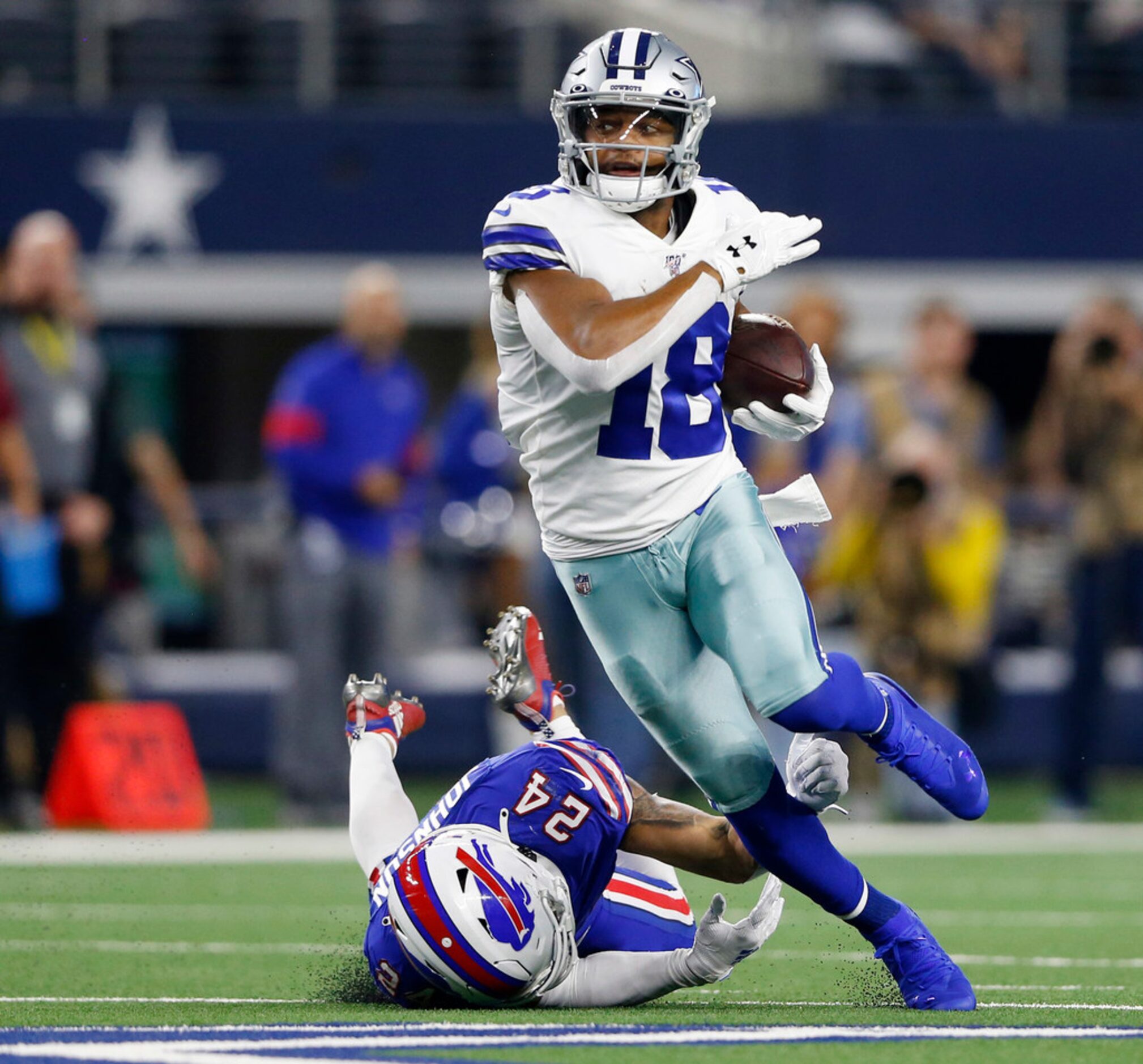 Dallas Cowboys wide receiver Randall Cobb (18) runs up the field after passing by Buffalo...