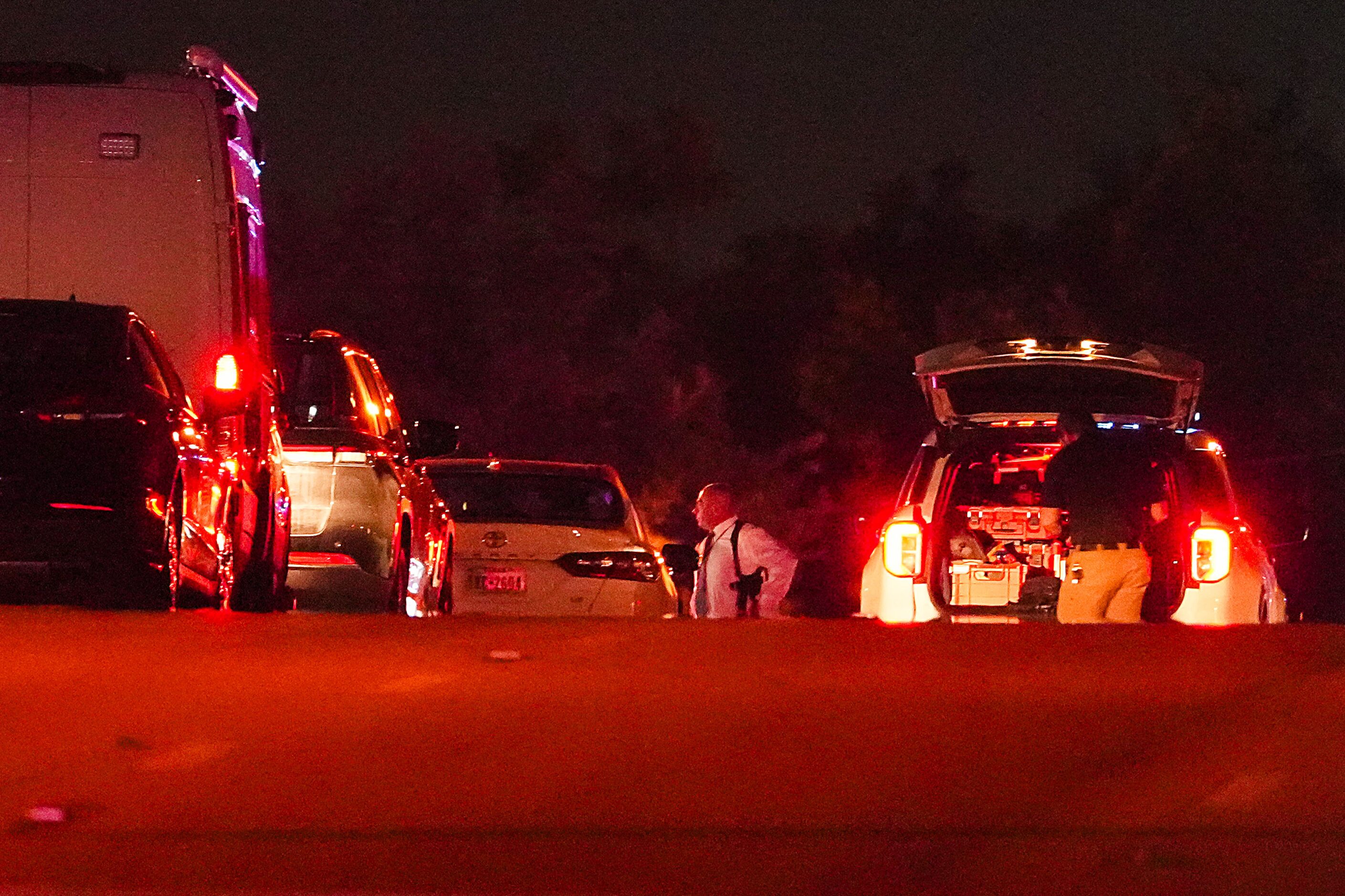 Dallas police work near the scene of a shooting in the 900 block of East Ledbetter Drive,...